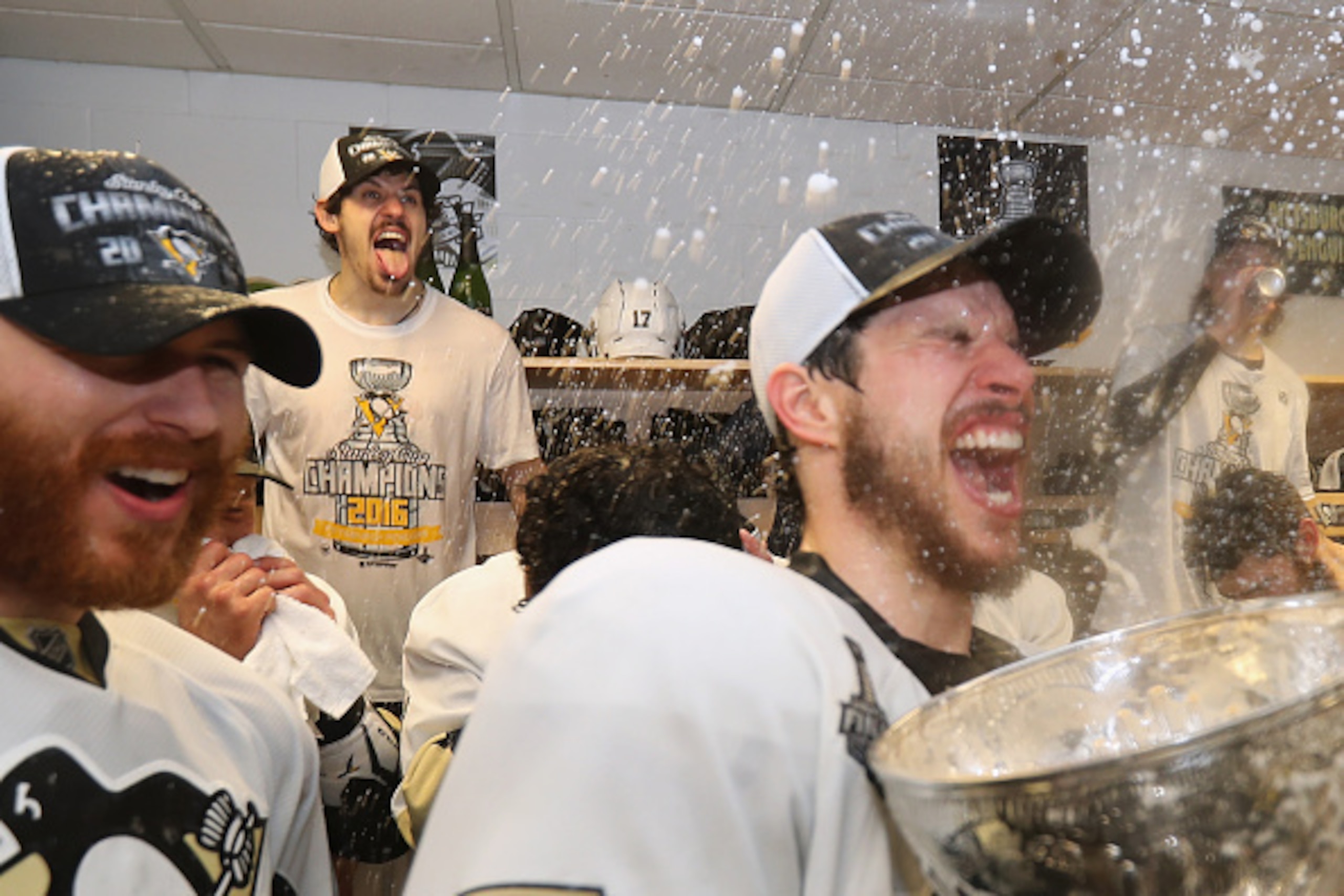 SAN JOSE, CA - JUNE 12:  Evgeni Malkin #71 and Sidney Crosby #87 of the Pittsburgh Penguins celebrates with the Stanley Cup in the locker room after winning Game 6 of the 2016 NHL Stanley Cup Final over the San Jose Sharks at SAP Center on June 12, 2016 i