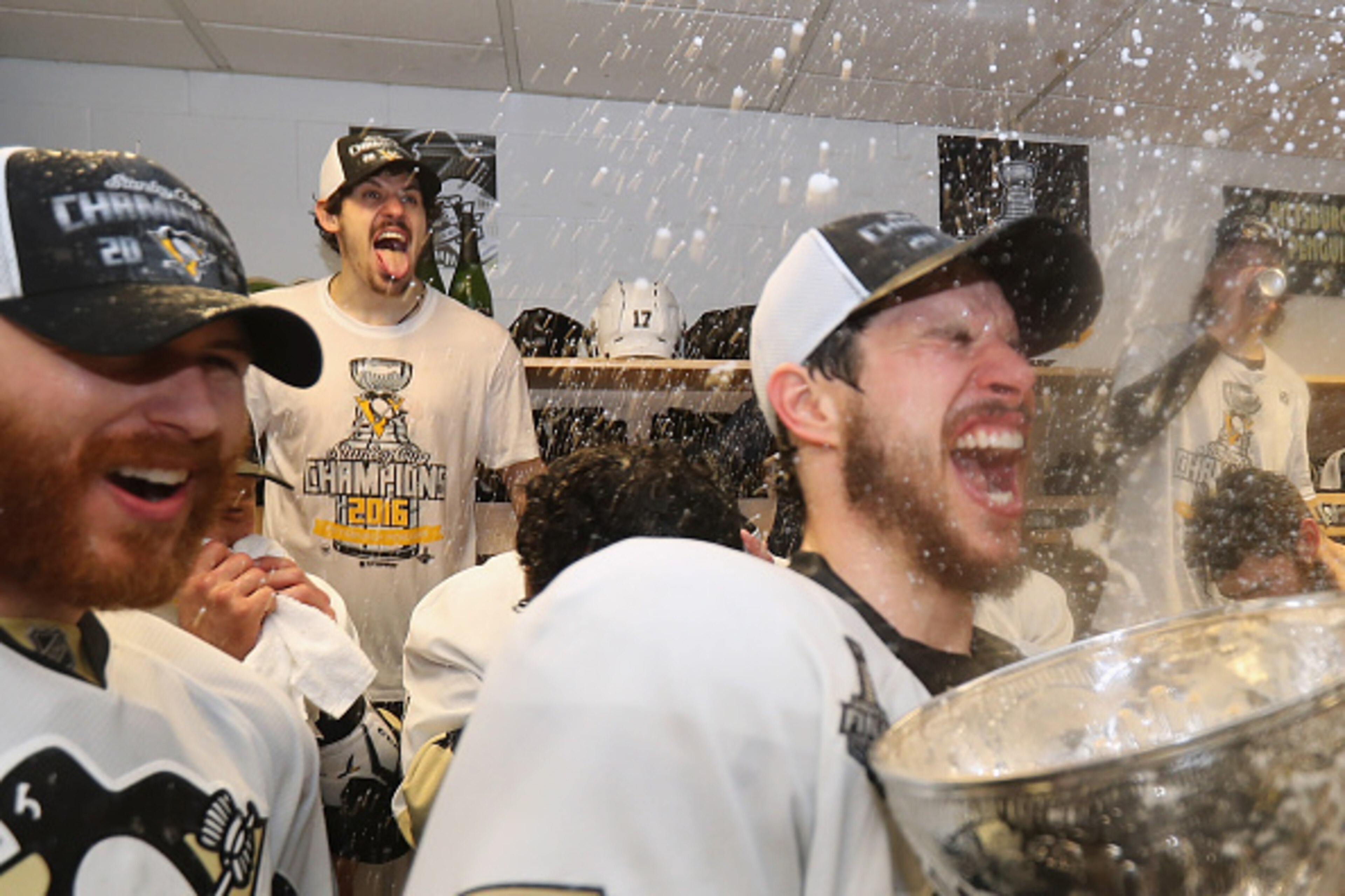 SAN JOSE, CA - JUNE 12:  Evgeni Malkin #71 and Sidney Crosby #87 of the Pittsburgh Penguins celebrates with the Stanley Cup in the locker room after winning Game 6 of the 2016 NHL Stanley Cup Final over the San Jose Sharks at SAP Center on June 12, 2016 i