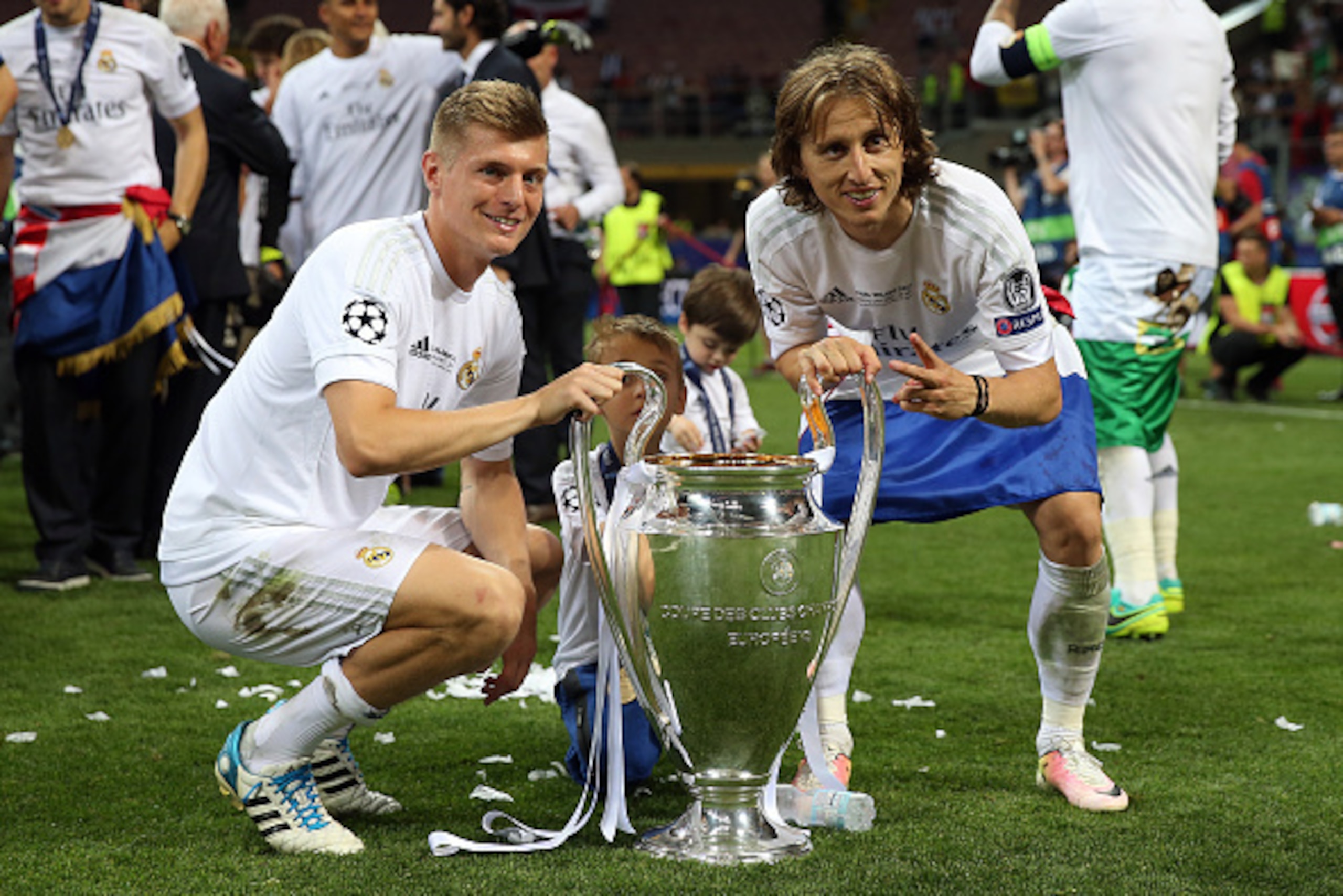 MILAN, ITALY - MAY 28: Toni Kroos (L) and Luka Modric of Real Madrid celebrate with the trophy following the UEFA Champions League Final between Real Madrid and Club Atletico de Madrid at Stadio Giuseppe Meazza on May 28, 2016 in Milan, Italy. (Photo by C