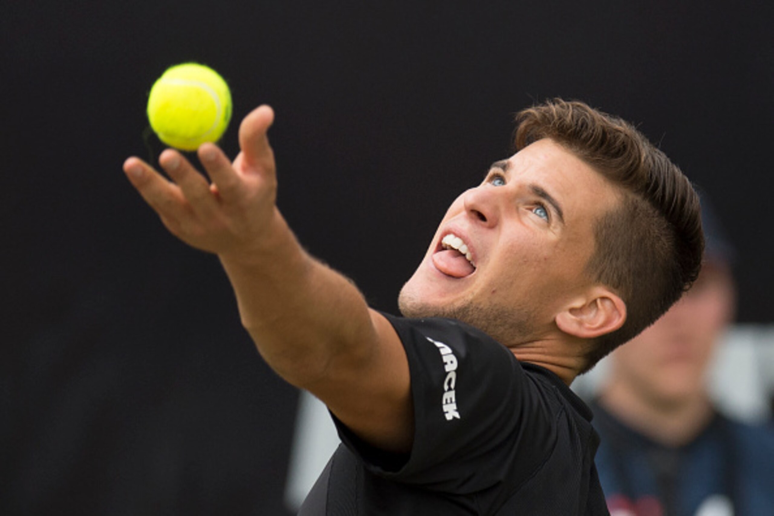 Austria's Dominic Thiem serves the ball to Germany's Philipp Kohlschreiber in the final match at the ATP Mercedes Cup tennis tournament in Stuttgart, southwestern Germany, on June 12, 2016.  / AFP / THOMAS KIENZLE        (Photo credit should read THOMAS K
