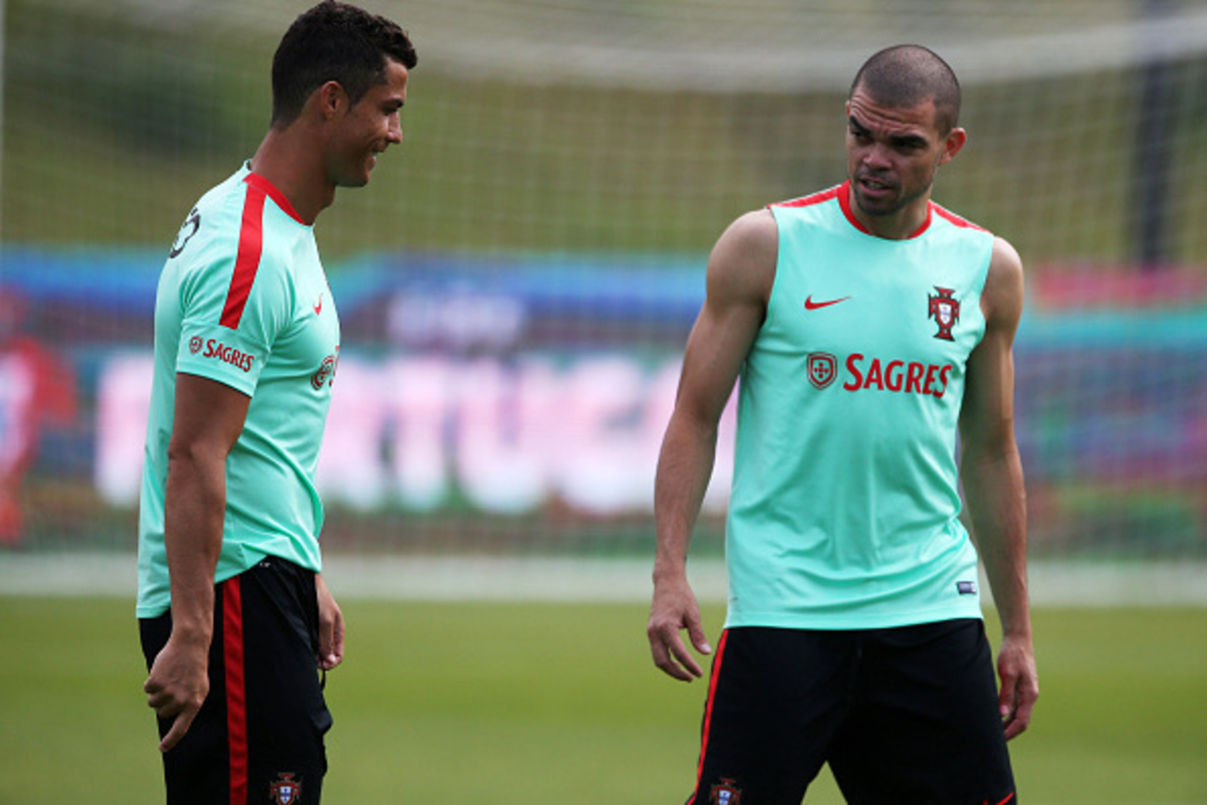 OEIRAS, PORTUGAL - JUNE 6:  Portugal's forward Cristiano Ronaldo (L) with Portugal's defender Pepe (R) during a Portugal training session in preparation for Euro 2016 at FPF Cidade do Futebol (City of Football) on June 6, 2016 in Oeiras (Lisbon), Portugal