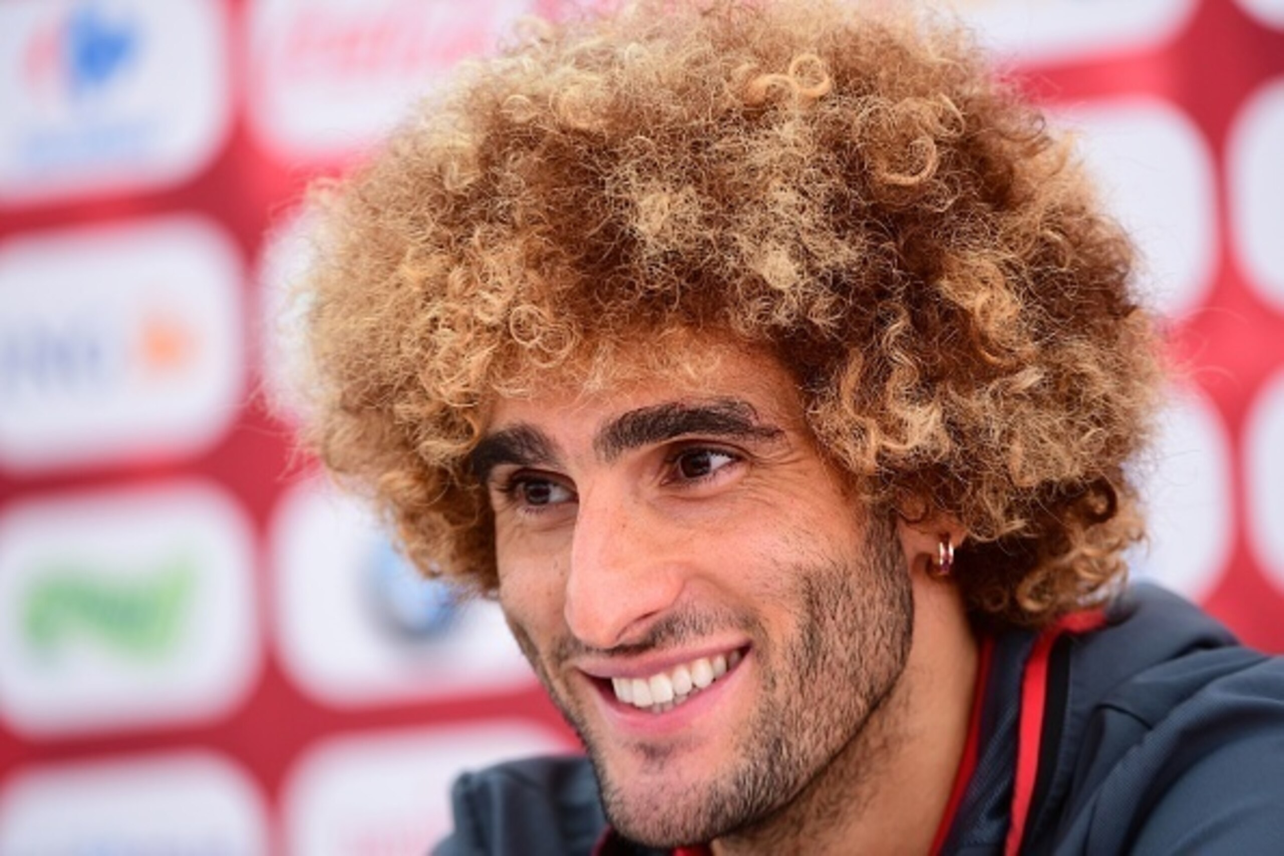 Belgium's midfielder Marouane Fellaini gives a press conference during the Euro 2016 football tournament at Le Haillan near Bordeaux, western France, on June 11, 2016. / AFP / EMMANUEL DUNAND        (Photo credit should read EMMANUEL DUNAND/AFP/Getty Imag