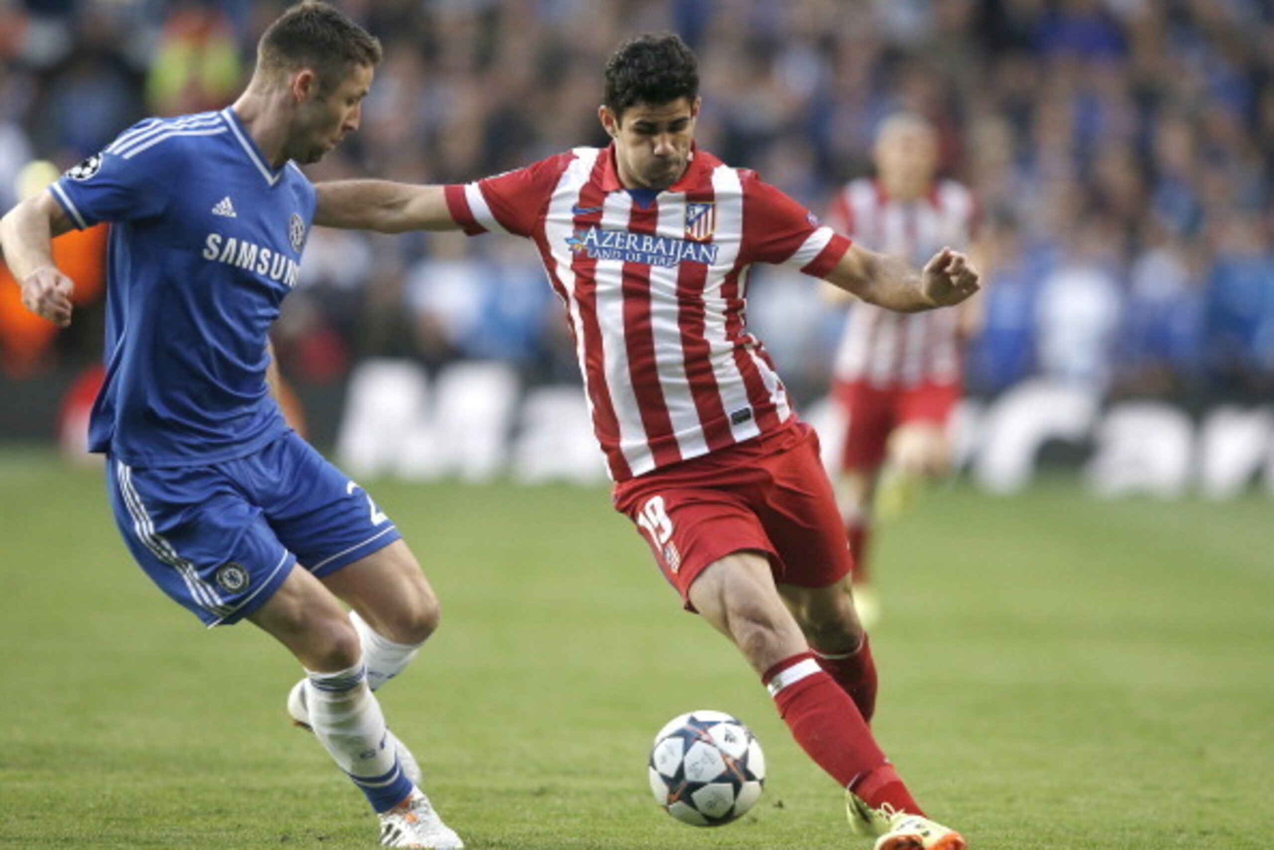 Chelsea's English defender Gary Cahill (L) challenges Atletico Madrid's Brazilian-born forward Diego da Silva Costa during the UEFA Champions League semi-final second leg football match between Chelsea and Atletico Madrid at Stamford Bridge in London on A