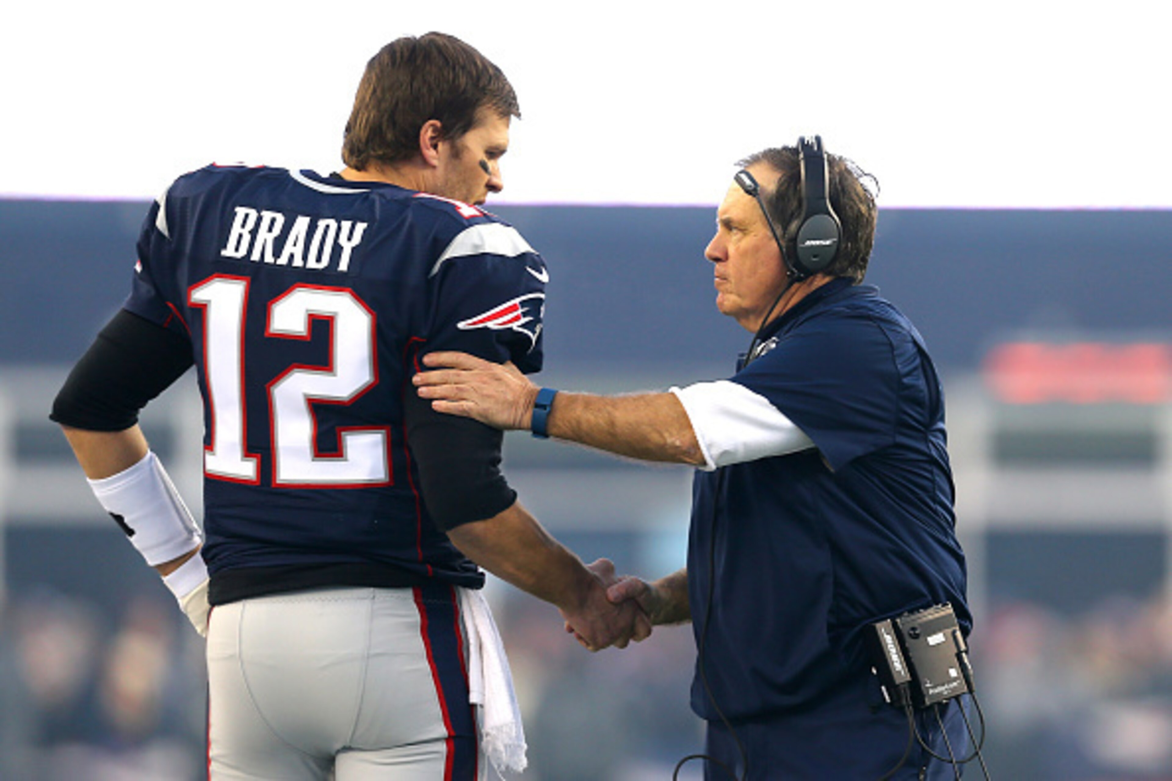 FOXBORO, MA - JANUARY 16: Tom Brady #12 and head coach Bill Belichick of the New England Patriots shake hands at the start of the AFC Divisional Playoff Game against the Kansas City Chiefs at Gillette Stadium on January 16, 2016 in Foxboro, Massachusetts.
