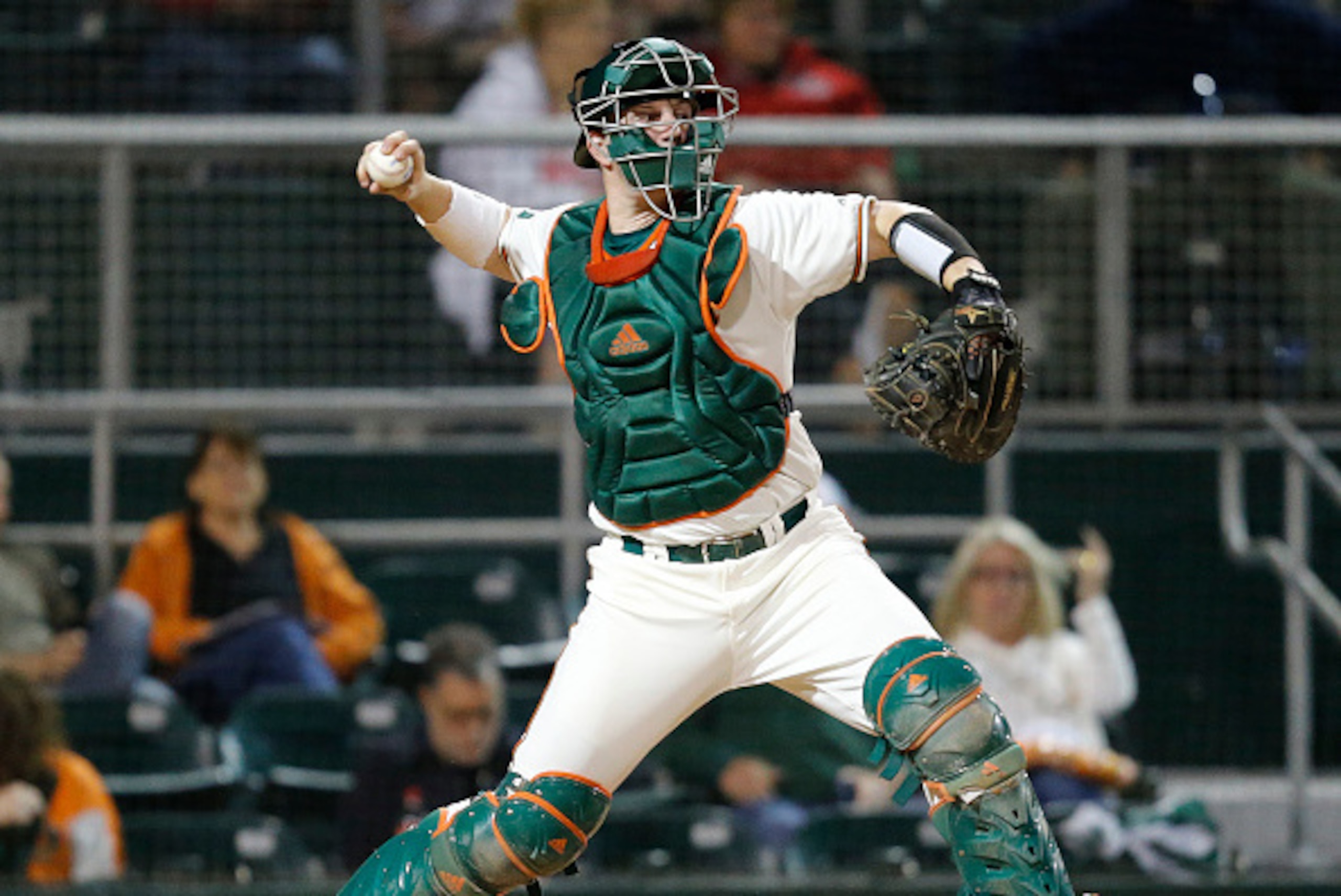 CORAL GABLES, FL - FEBRUARY 19: Zack Collins #0 of the Miami Hurricanes throws the ball to second base against the Rutgers Scarlet Knights on February 19, 2016 at Alex Rodriguez Park at Mark Light Field in Coral Gables, Florida. Miami defeated Rutgers 4-1