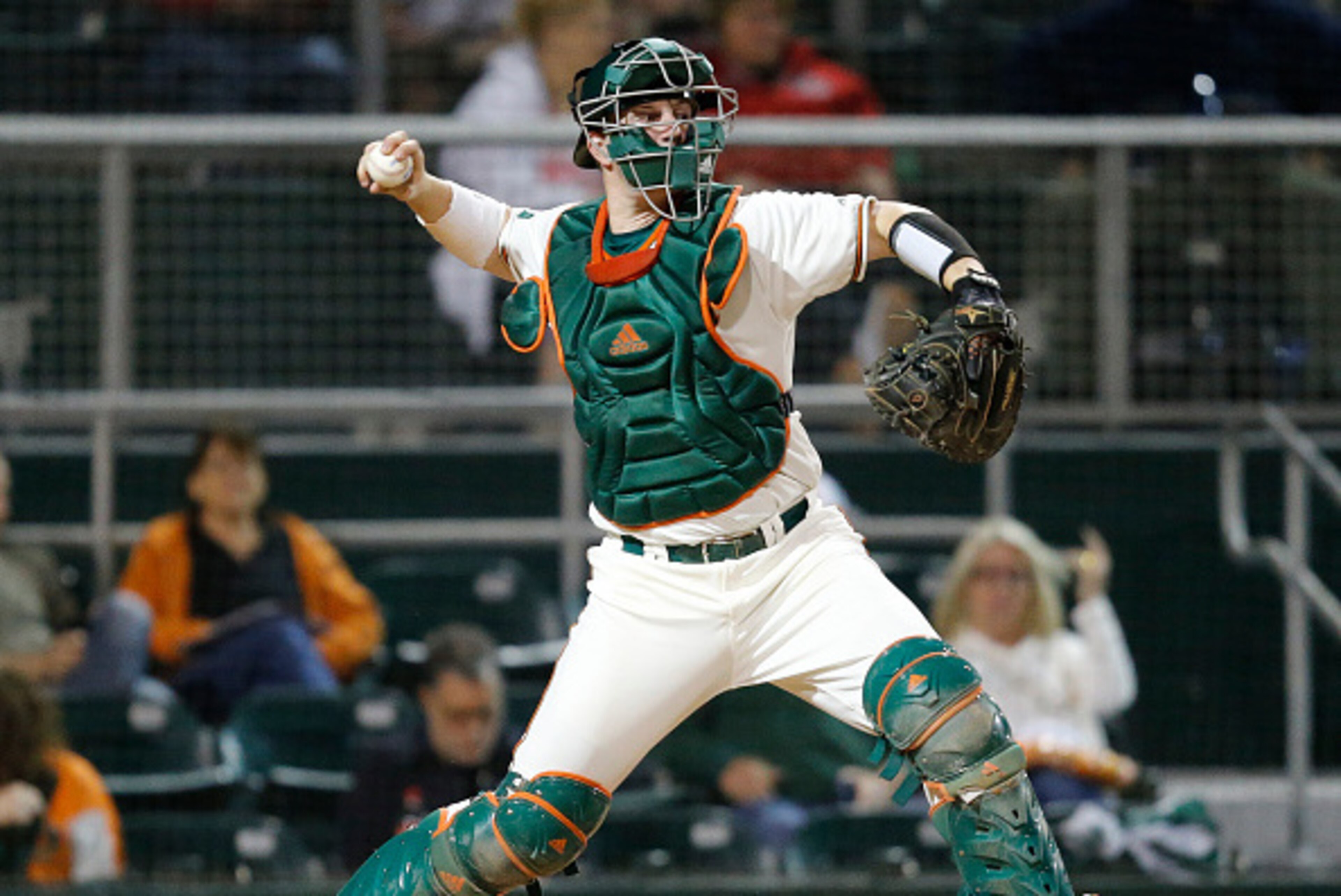 CORAL GABLES, FL - FEBRUARY 19: Zack Collins #0 of the Miami Hurricanes throws the ball to second base against the Rutgers Scarlet Knights on February 19, 2016 at Alex Rodriguez Park at Mark Light Field in Coral Gables, Florida. Miami defeated Rutgers 4-1