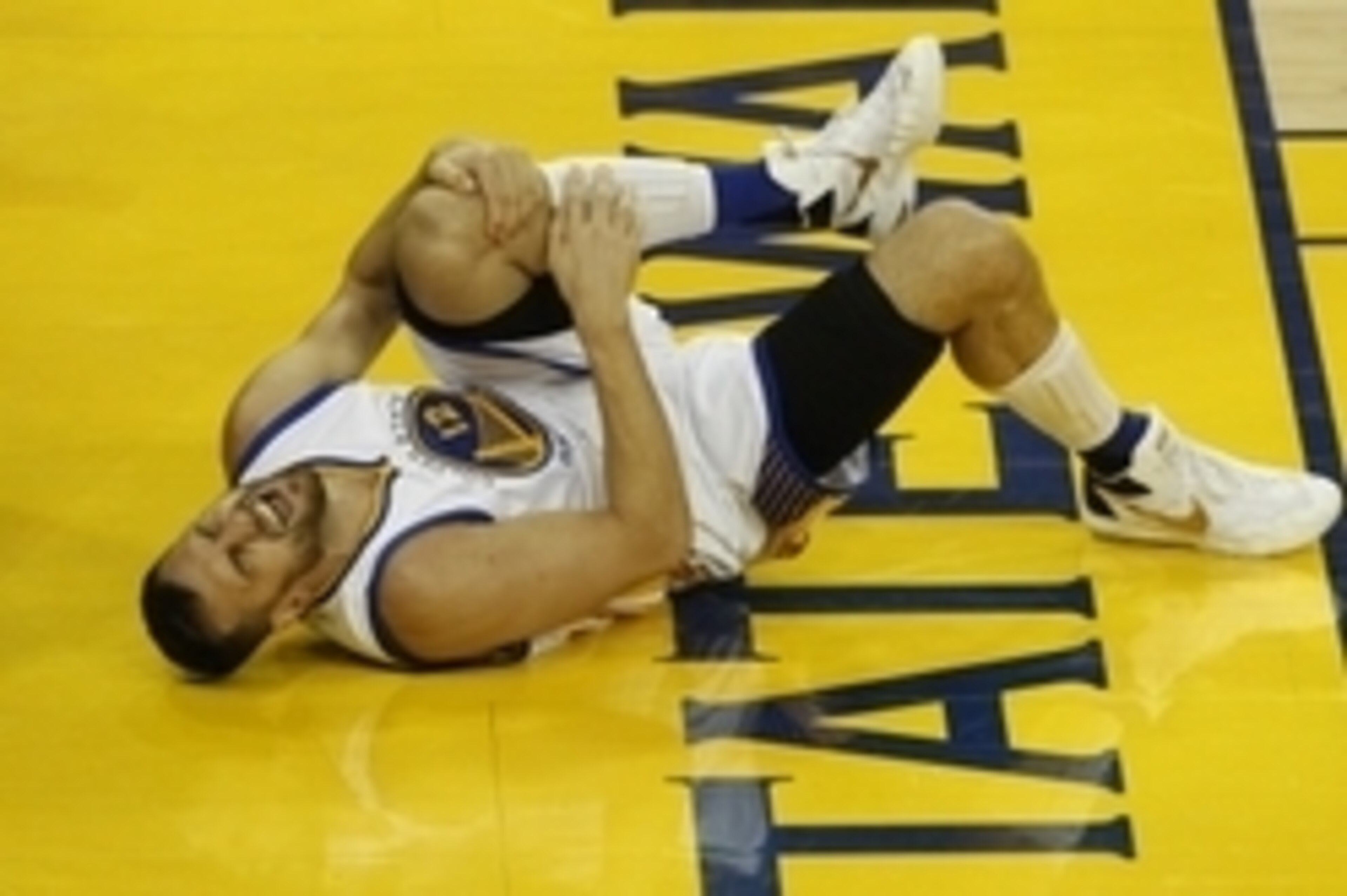 June 13, 2016; Oakland, CA, USA; Golden State Warriors center Andrew Bogut (12) reacts after suffering an apparent injury against Cleveland Cavaliers during the second half in game five of the NBA Finals at Oracle Arena. Mandatory Credit: Cary Edmondson-U