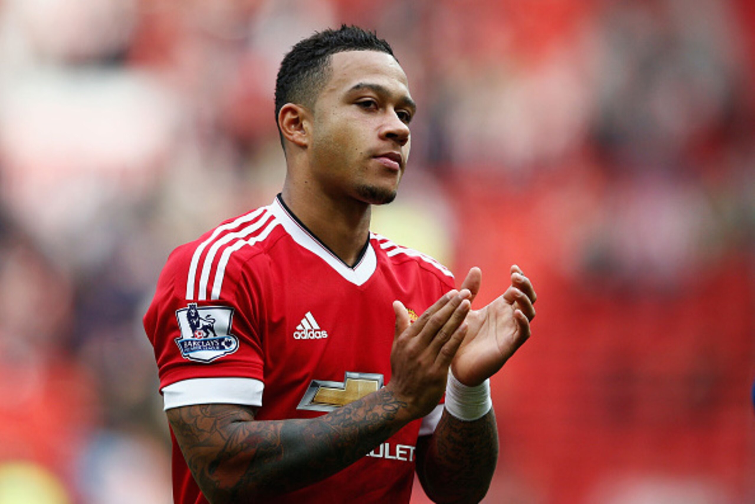 MANCHESTER, ENGLAND - SEPTEMBER 26:  Memphis Depay of Manchester United celebrates his team's 3-0 win in the Barclays Premier League match between Manchester United and Sunderland at Old Trafford on September 26, 2015 in Manchester, United Kingdom.  (Phot