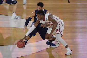 HOUSTON, TX - APRIL 02: Josh Hart #3 of the Villanova Wildcats and Buddy Hield #24 of the Oklahoma Sooners battle for a loose ball during the 2016 NCAA Men's Final Four Semifinal at NRG Stadium on April 02, 2016 in Houston, Texas. (Photo by Lance King/Get
