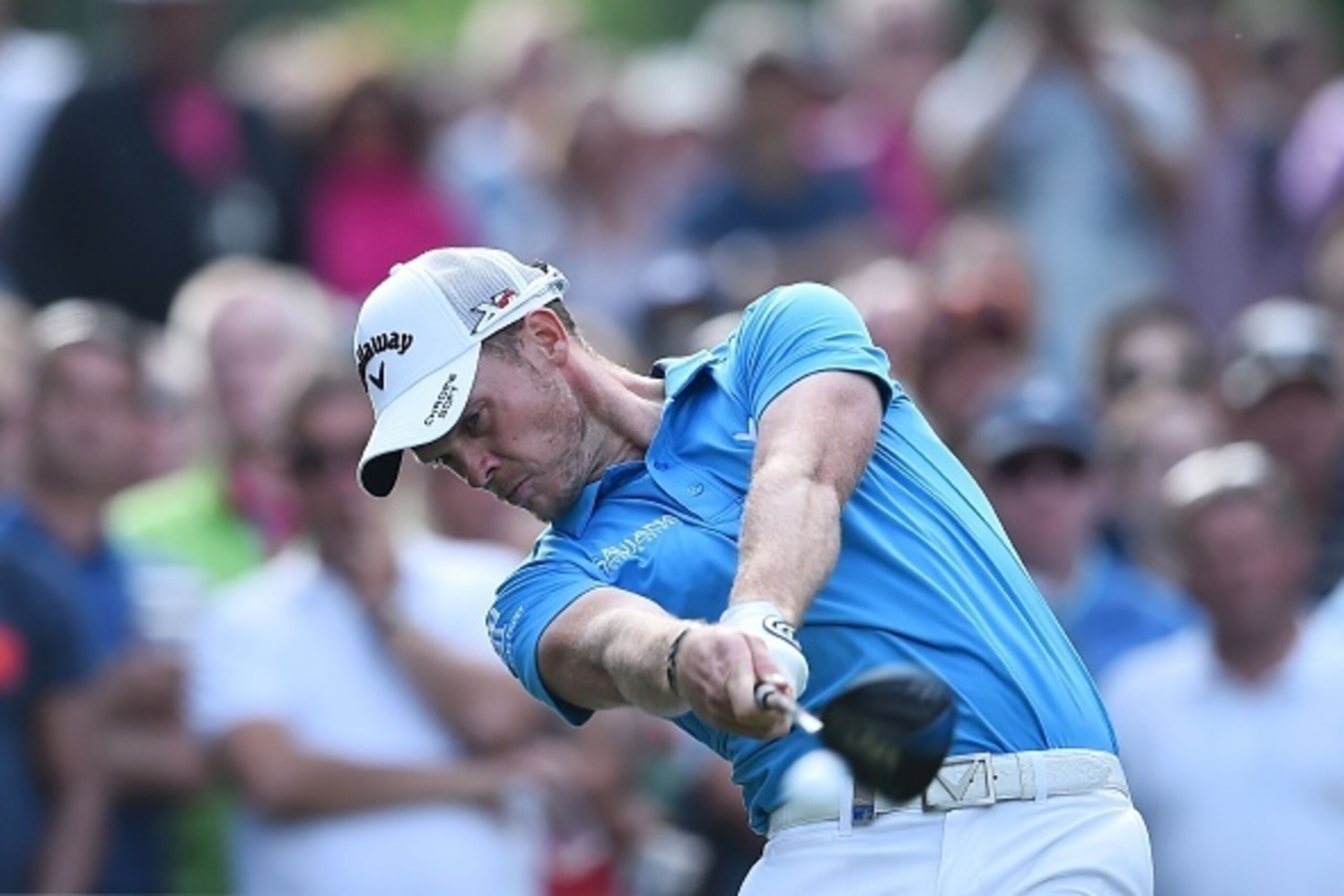 Danny Willett plays a tee shot on the 16th hole during the third day of the PGA Championship at Wentworth Golf Club in Surrey, south west of London, on May 28, 2016. / AFP / BEN STANSALL        (Photo credit should read BEN STANSALL/AFP/Getty Images)