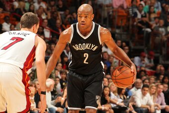 MIAMI, FL - DECEMBER 28: Jarrett Jack #2 of the Brooklyn Nets defends the ball against the Miami Heat during the game on December 28, 2015 at American Airlines Arena in Miami, Florida. NOTE TO USER: User expressly acknowledges and agrees that, by download