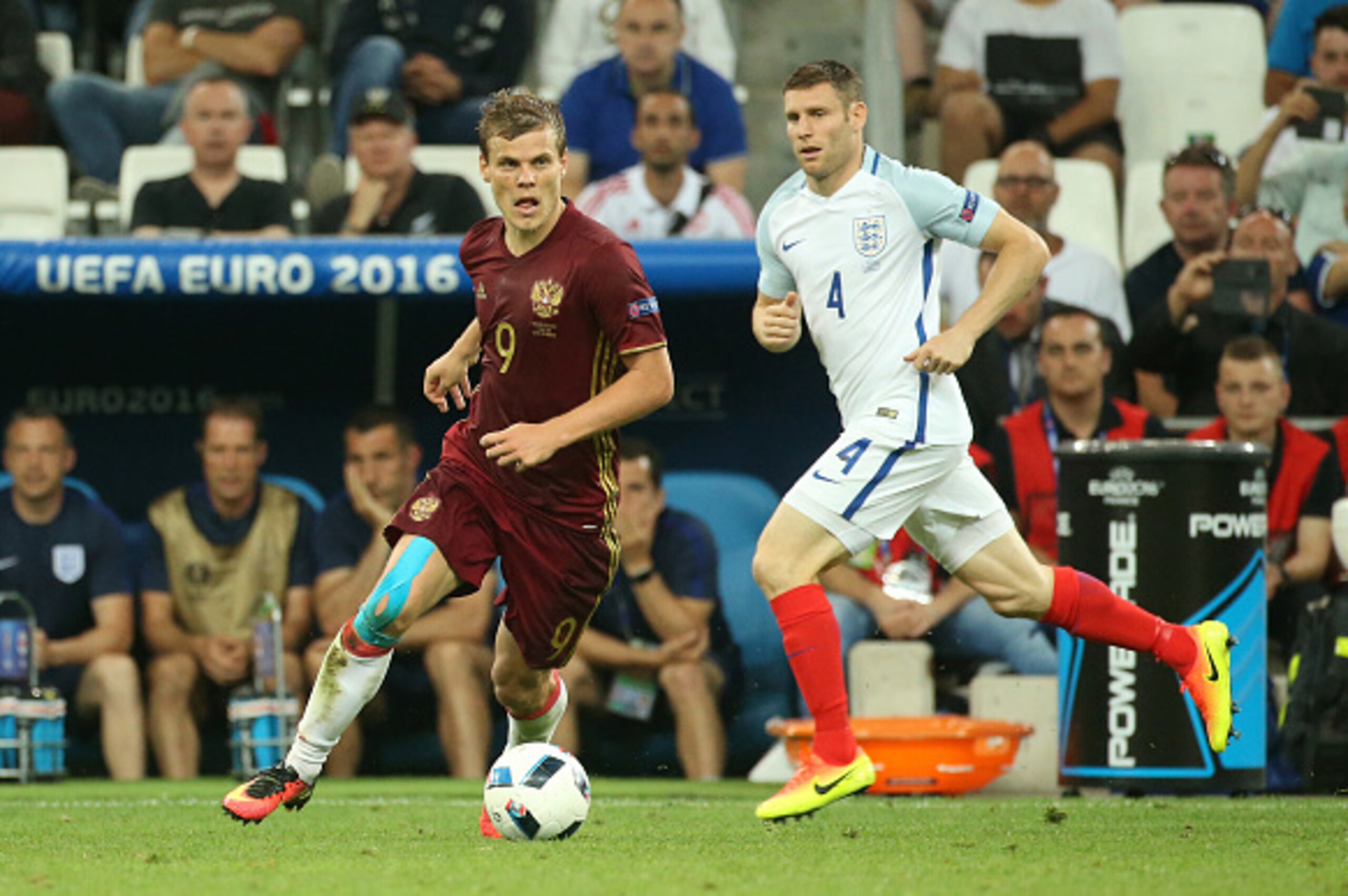 MARSEILLE, FRANCE - JUNE 11: Roman Neustadter of Russia and James Milner of England in action during the UEFA Euro 2016 Group B match between England and Russia at Stade Velodrome on June 11, 2016 in Marseille, France. (Photo by Jean Catuffe/Getty Images)