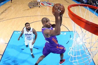 OKLAHOMA CITY, OK - FEBRUARY 4: Patrick Christopher #19 of the Iowa Energy shoots against Reggie Williams #14 of the Tulsa 66ers during an NBA D-League game on February 4, 2014 at the Chesapeake Energy Arena in Oklahoma City, Oklahoma. NOTE TO USER: User 