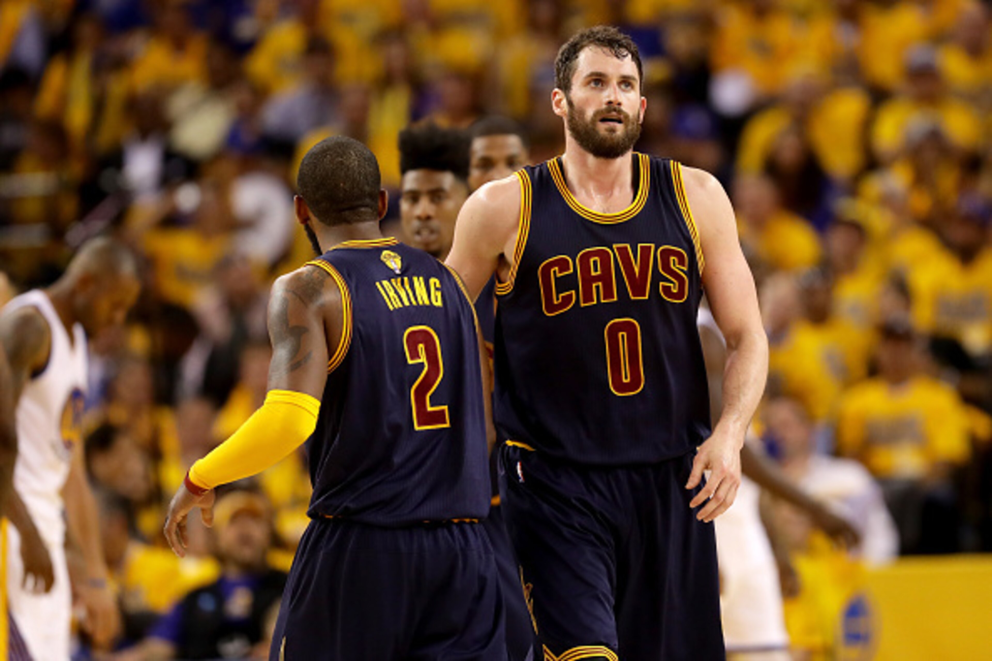 OAKLAND, CA - JUNE 02:  Kevin Love #0 of the Cleveland Cavaliers reacts alongside teammate Kyrie Irving #2 in the second half while taking on the Golden State Warriors in Game 1 of the 2016 NBA Finals at ORACLE Arena on June 2, 2016 in Oakland, California