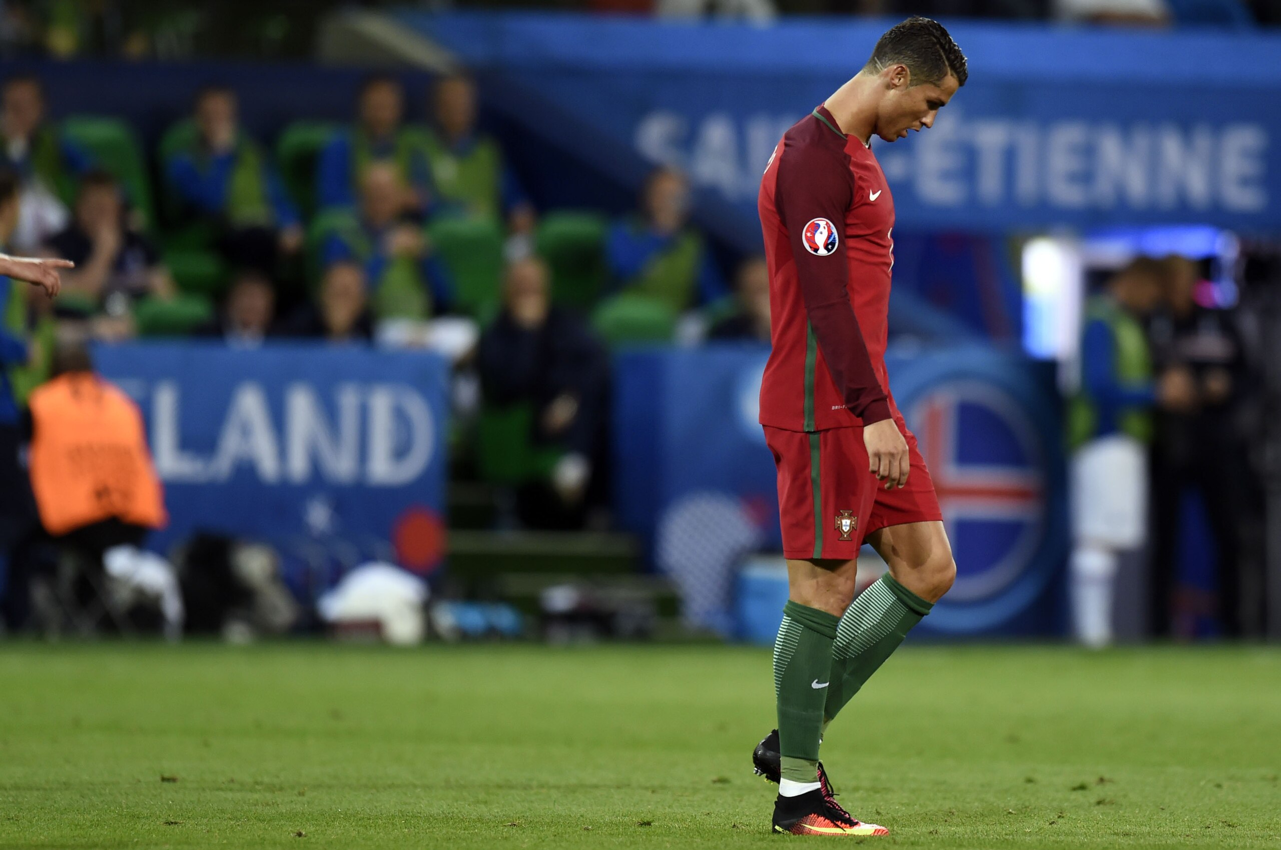 Portugal's forward Cristiano Ronaldo reacts during the Euro 2016 group F football match between Portugal and Iceland at the Geoffroy-Guichard stadium in Saint-Etienne on June 14, 2016. / AFP / PHILIPPE DESMAZES        (Photo credit should read PHILIPPE DE