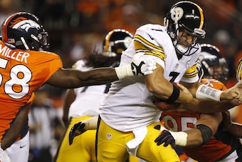 Miller often helped teammates like Derek Wolfe (bottom right) record sacks.