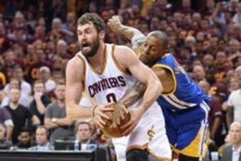 Jun 10, 2016; Cleveland, OH, USA; Golden State Warriors forward Andre Iguodala (9) attempts to knock the ball away from Cleveland Cavaliers forward Kevin Love (0) during the third quarter in game four of the NBA Finals at Quicken Loans Arena. Mandatory Cr