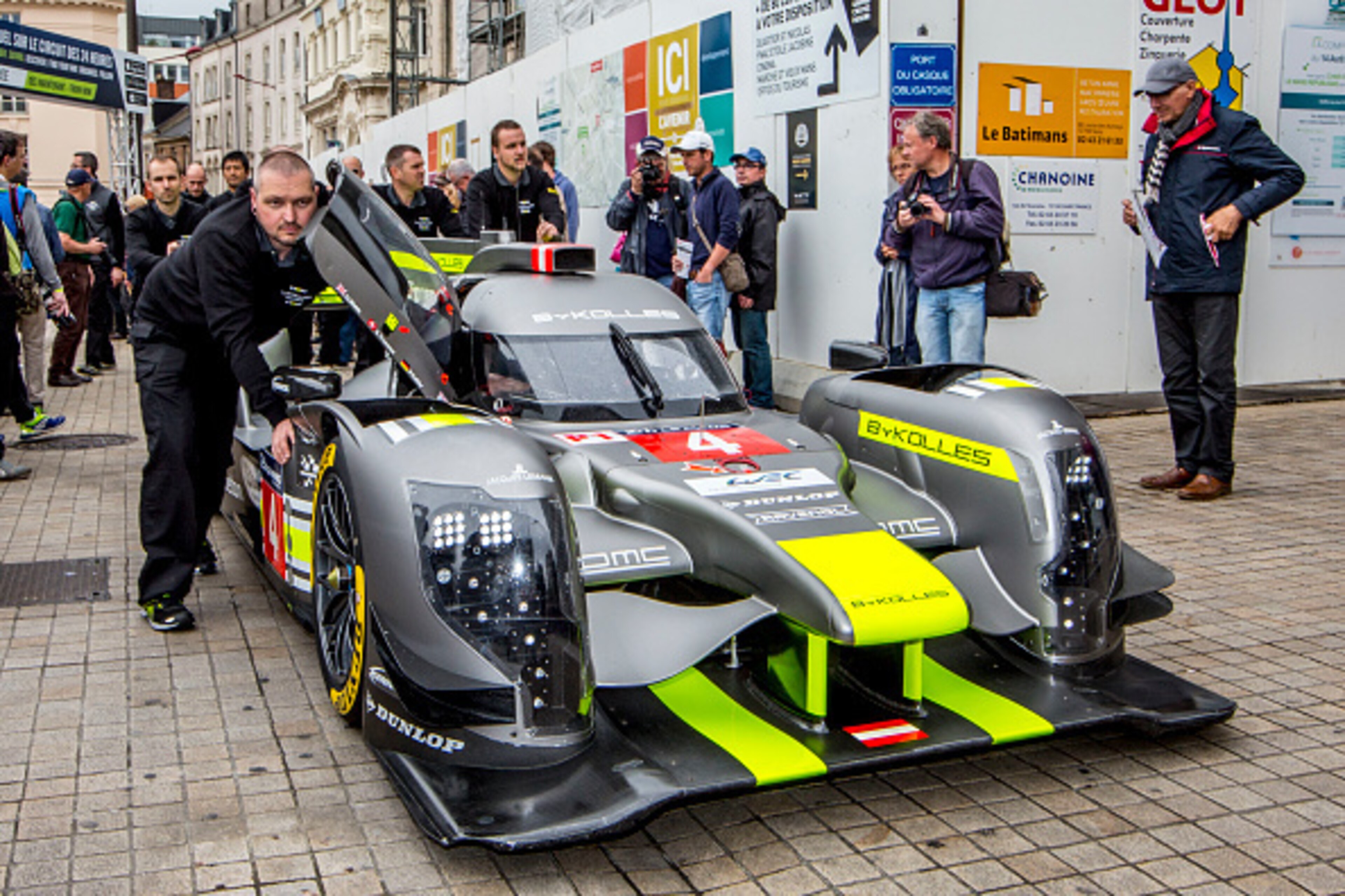 LE MANS, FRANCE - JUNE 13:  Crewmen push the #4 CLM P1/01 AER of  Simon Trummer, of Switzerland, Oliver Webb, Great Britain, and Pierre Kaffer, of Germany,  during scrutineering for the Le Mans 24 Hour Race on June 13, 2016 in Le Mans, France.  (Photo by 