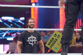 Seth Rollins eyes Roman Reigns on Raw.