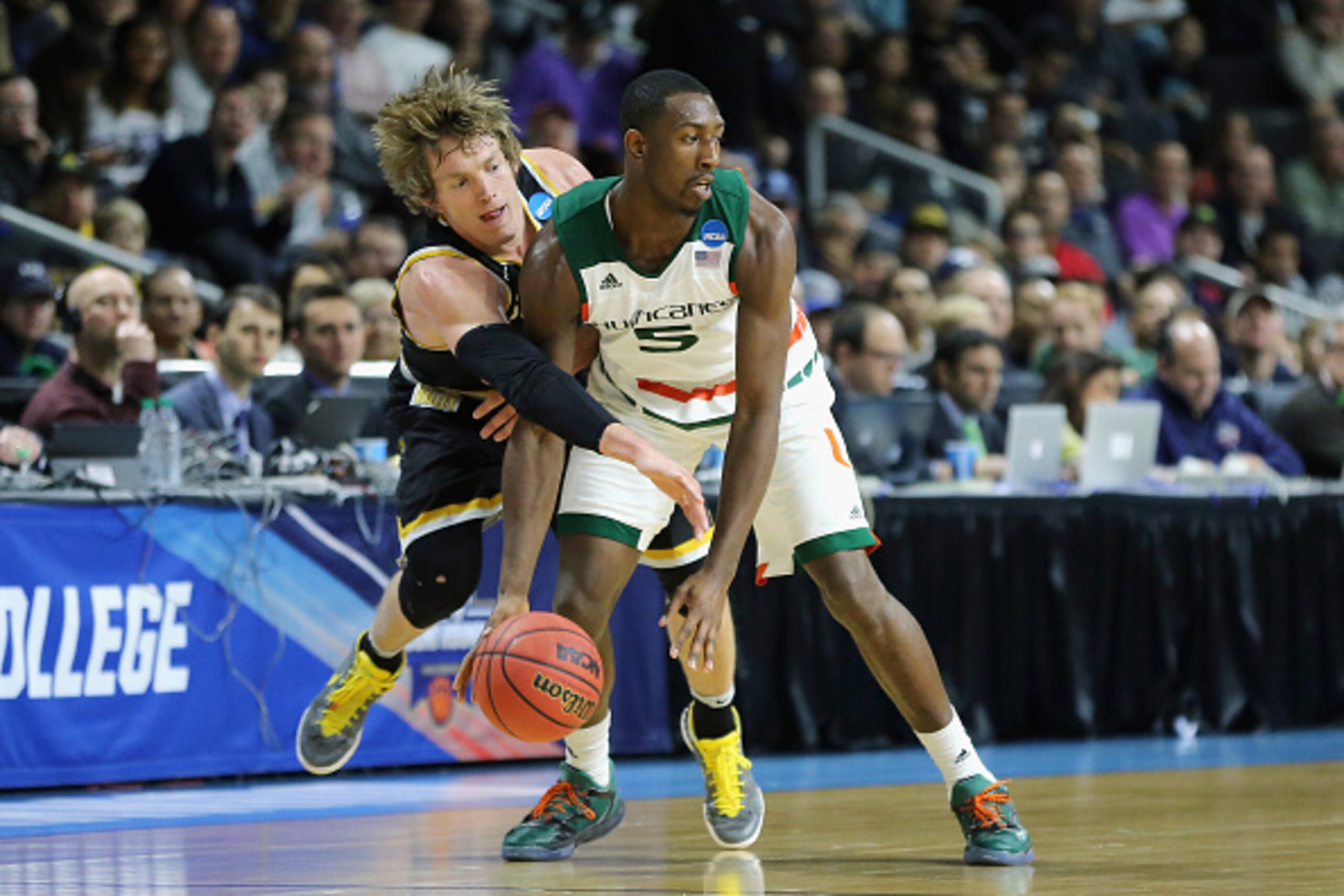 PROVIDENCE, RI - MARCH 19:  Ron Baker #31 of the Wichita State Shockers battles for the ball with Davon Reed #5 of the Miami Hurricanes in the second half of their game during the second round of the 2016 NCAA Men's Basketball Tournament at Dunkin' Donuts