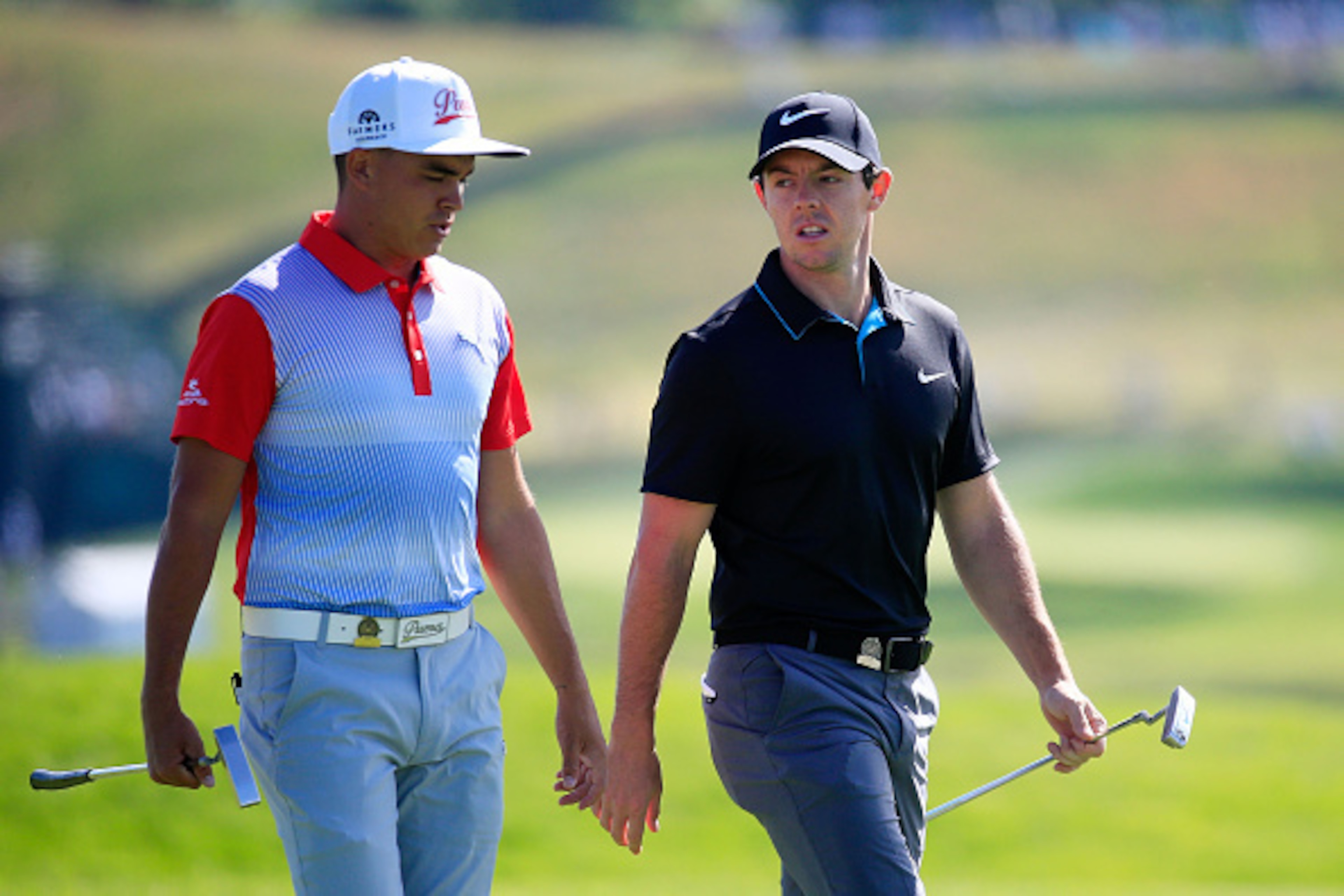 OAKMONT, PA - JUNE 14:  Rickie Fowler of the United States and Rory McIlroy of Northern Ireland  walk up the fairway during a practice round prior to the U.S. Open at Oakmont Country Club on June 14, 2016 in Oakmont, Pennsylvania.  (Photo by Rob Carr/Gett