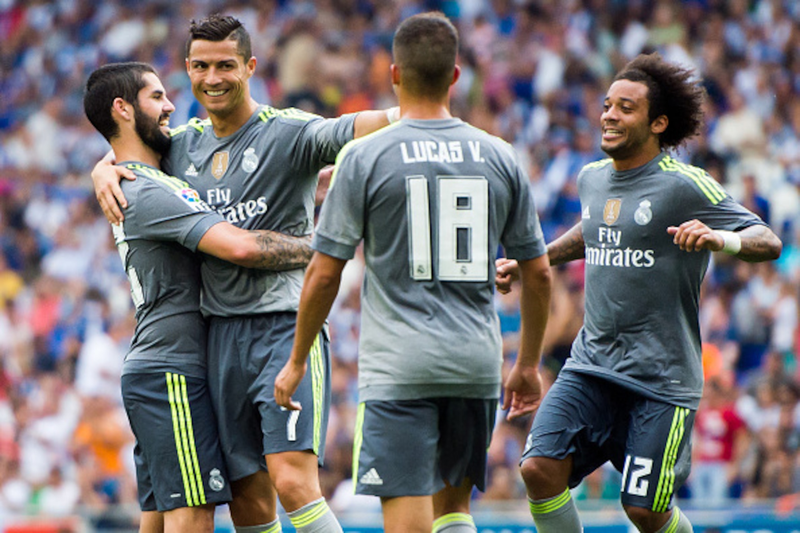 BARCELONA, SPAIN - SEPTEMBER 12:  Cristiano Ronaldo of Real Madrid CF celebrates with his teammates Francisco Alarcon 'Isco' (L), Lucas Vazquez (C) and Marcelo after scoring his team's sixth goal during the La Liga match between RCD Espanyol and Real Madr