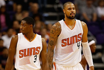 PHOENIX, AZ - OCTOBER 07:  Brandon Knight #3 and Tyson Chandler #4 of the Phoenix Suns walk the court during the first half ot he preseason NBA game against the Sacramento Kings at Talking Stick Resort Arena on October 7, 2015 in Phoenix, Arizona. NOTE TO
