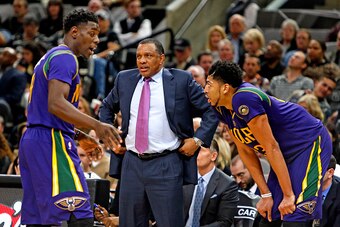 SAN ANTONIO,TX - FEBRUARY 3: Anthony Davis #23 of the New Orleans Pelicans and Jrue Holiday #11 of the New Orleans Pelicans talk while head coach Alvin Gentry surveys the game against  the San Antonio Spurs at AT&T Center on February 3, 2016 in San Antoni