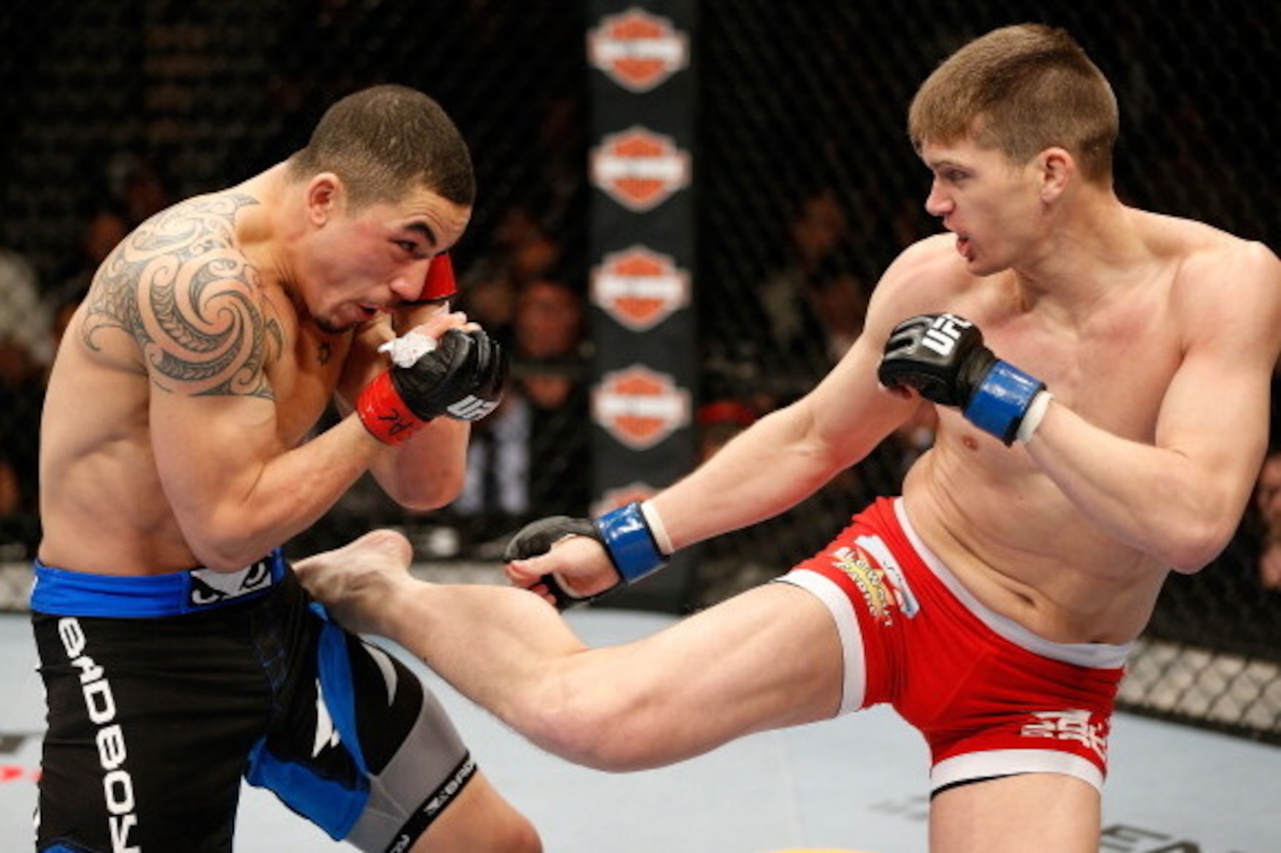 LAS VEGAS, NV - FEBRUARY 22:  (R-L) Stephen Thompson kicks Robert Whittaker in their welterweight bout during UFC 170 inside the Mandalay Bay Events Center on February 22, 2014 in Las Vegas, Nevada. (Photo by Josh Hedges/Zuffa LLC/Zuffa LLC via Getty Imag