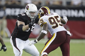 Corbin looks to block Chris Wilson, then of the Washington Redskins.