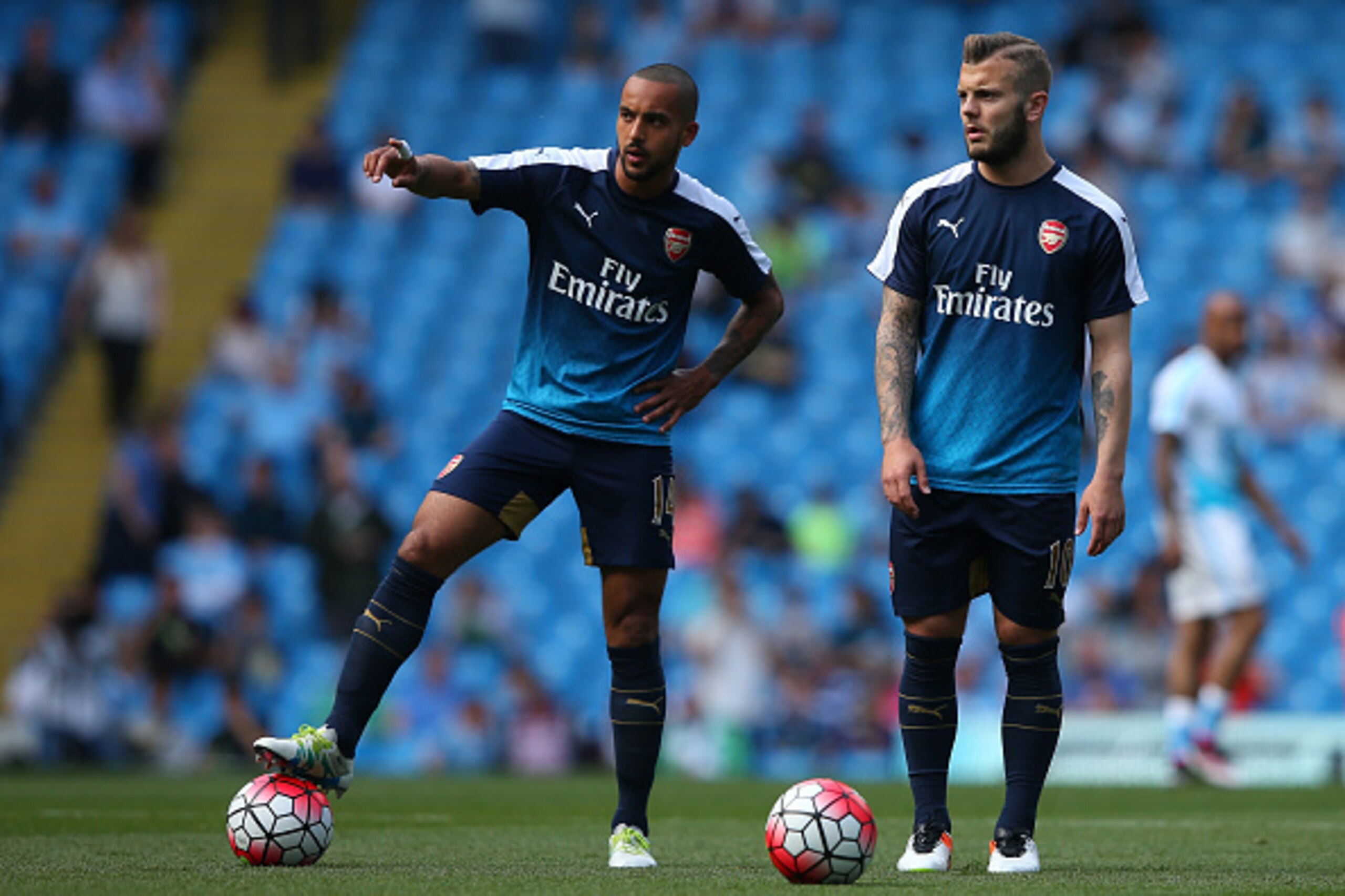 MANCHESTER, ENGLAND - MAY 08:  Theo Walcott of Arsenal (L) and Jack Wilshere of Arsenal warm up prior to the Barclays Premier League match between Manchester City and Arsenal at the Etihad Stadium on May 8, 2016 in Manchester, England.  (Photo by Alex Liv