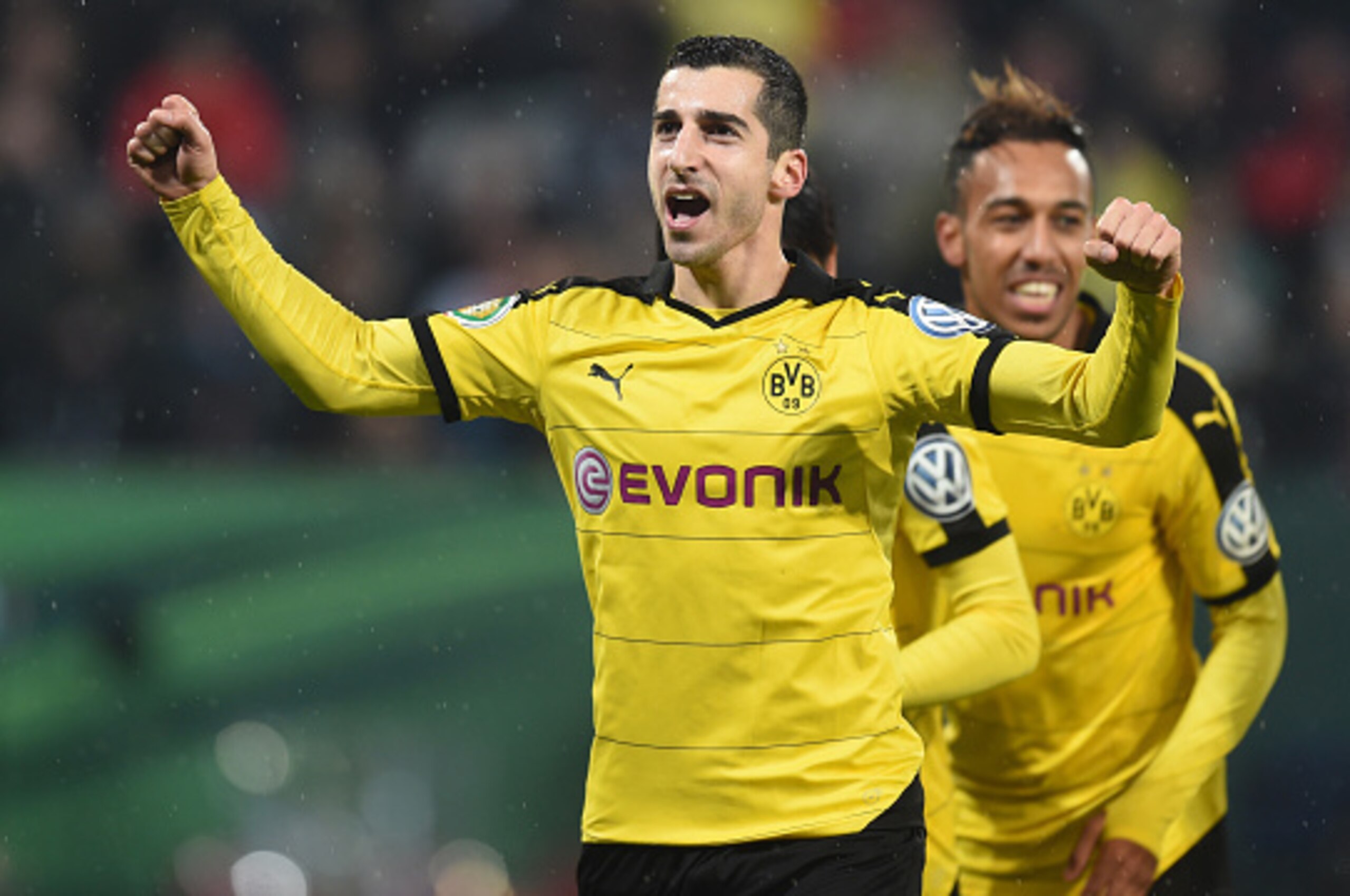 (L-R) Dortmund's Armenian midfielder Henrikh Mkhitaryan, Dortmund's Gabonese striker Pierre-Emerick Aubameyang celebrate after the second goal during the German Cup DFB Pokal third round match between Borussia Dortmund and FC Augsburg in Augsburg on Decem