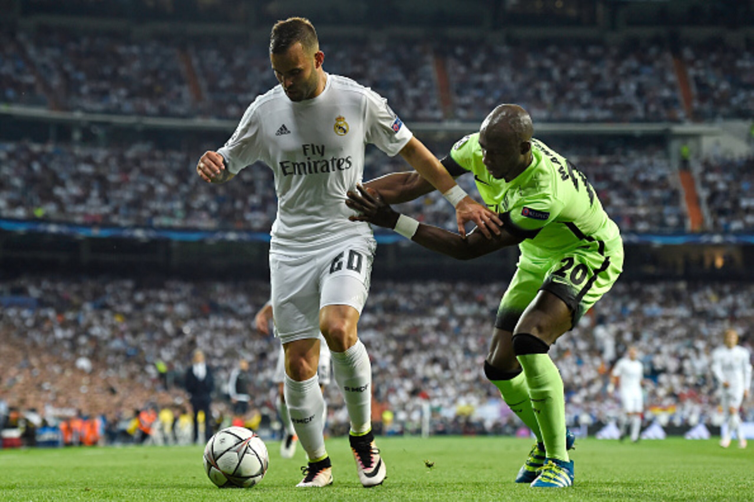 MADRID, SPAIN - MAY 04:  Jese of Real Madrid is challenged by Eliaquim Mangala of Manchester City during the UEFA Champions League semi final, second leg match between Real Madrid and Manchester City FC at Estadio Santiago Bernabeu on May 4, 2016 in Madri