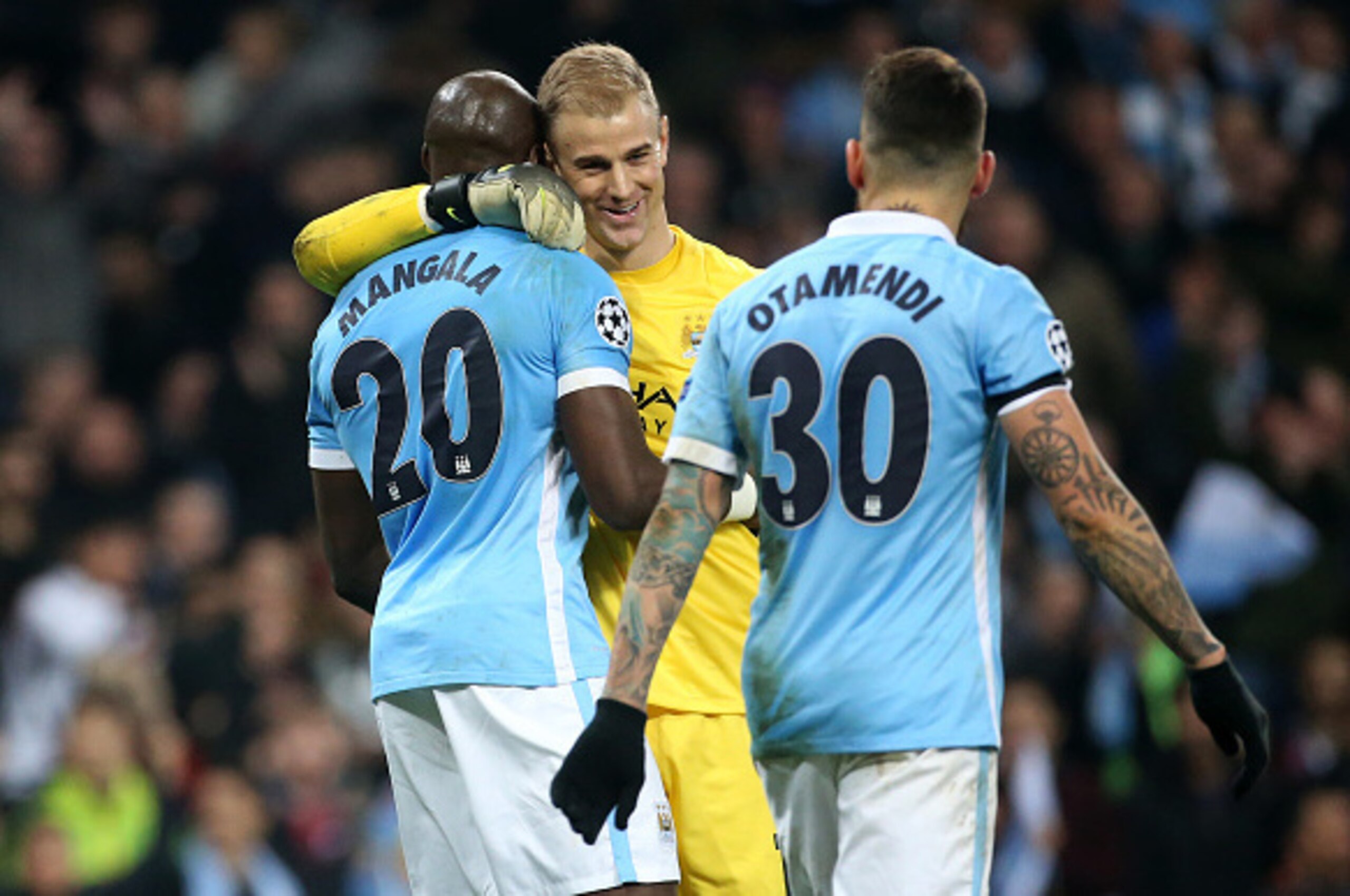 MANCHESTER, ENGLAND - APRIL 12: Goalkeeper of Manchester City Joe Hart greets Eliaquim Mangala while Nicolas Otamendi of Manchester City looks on during the UEFA Champions League quarter final second leg match between Manchester City and Paris Saint-Germa