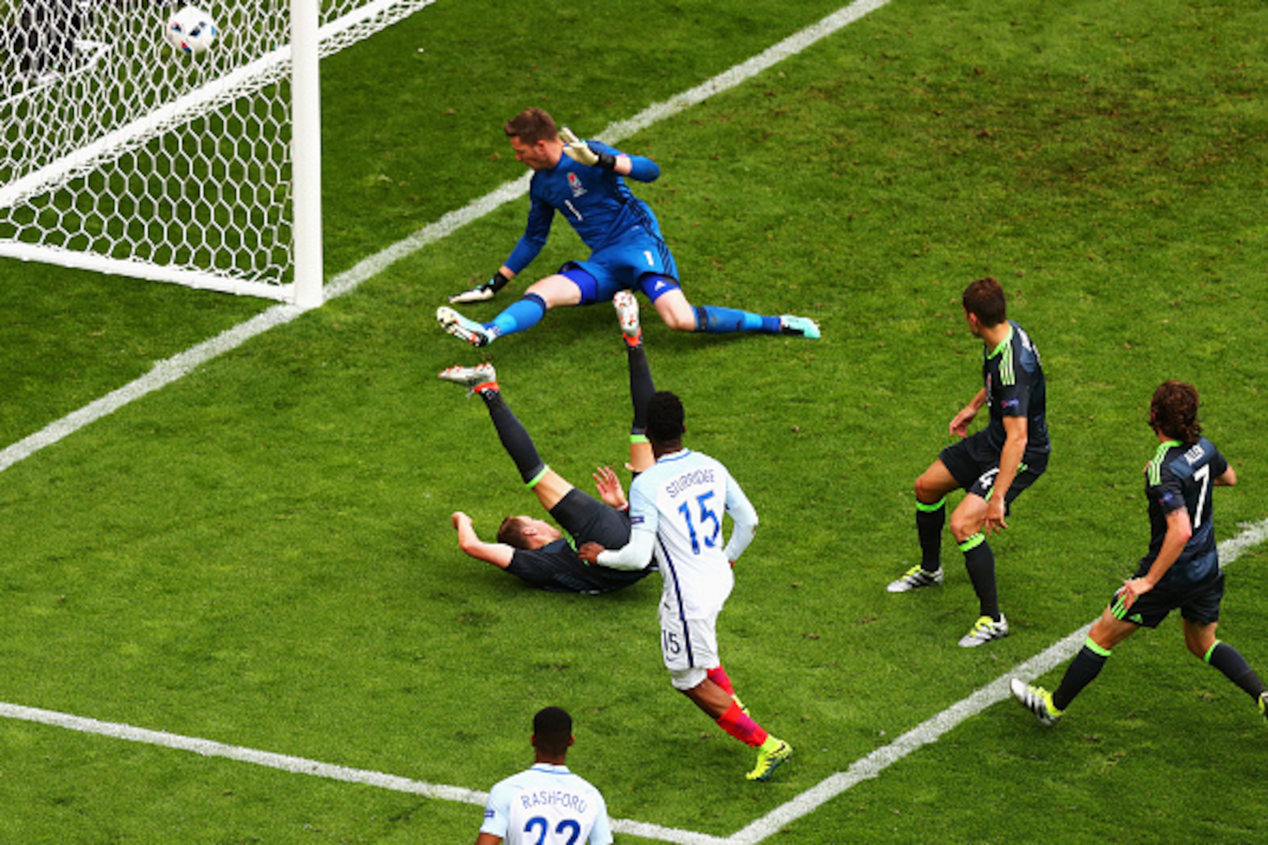 LENS, FRANCE - JUNE 16:  Daniel Sturridge of England scores his team's second goal past Wayne Hennessey of Wales during the UEFA EURO 2016 Group B match between England and Wales at Stade Bollaert-Delelis on June 16, 2016 in Lens, France.  (Photo by Clive