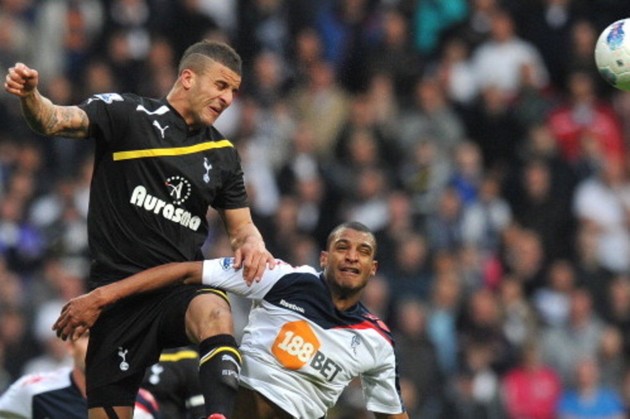 Bolton Wanderers' French forward David N'Gog (R) vies with Tottenham Hotspur's English defender Kyle Walker during the English Premier League football match between Bolton Wanderers and Tottenham Hotspur at The Reebok stadium, Bolton, north-west England o