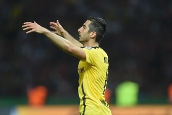 Dortmund's Armenian midfielder Henrikh Mkhitaryan reacts during the German Cup (DFB Pokal) final football match Bayern Munich vs Borussia Dortmund at the Olympic stadium in Berlin on May 21, 2016. / AFP / Christof STACHE / RESTRICTIONS: ACCORDING TO DFB R