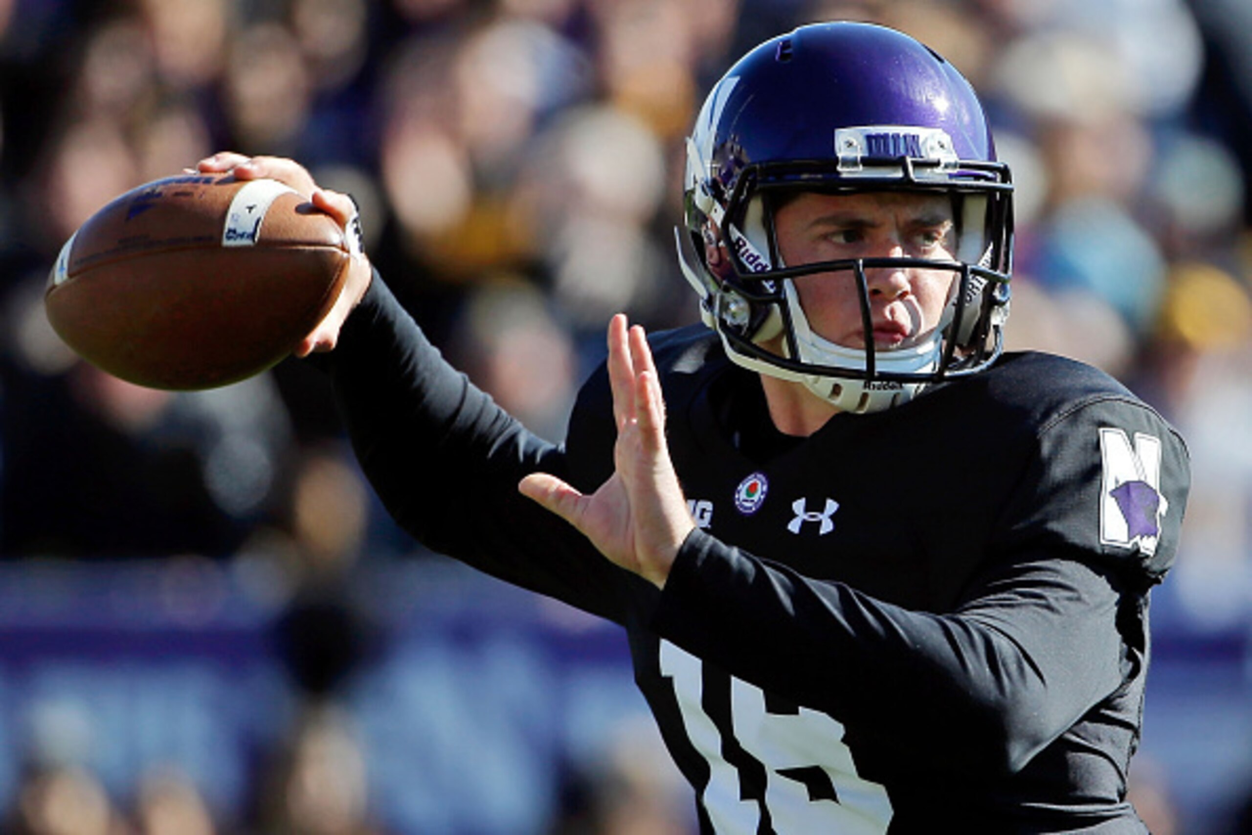 EVANSTON, IL - OCTOBER 17:  Clayton Thorson #18 of the Northwestern Wildcats looks to pass during the first quarter against the Iowa Hawkeyes at Ryan Field on October 17, 2015 in Evanston, Illinois.  (Photo by Jon Durr/Getty Images)