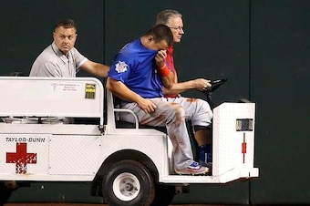 Kyle Schwarber being carted off