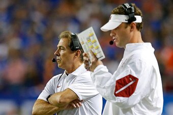 ATLANTA, GA - DECEMBER 5: Head coach Nick Saban of the Alabama Crimson Tide and offensive coordinator Lane Kiffin of the Alabama Crimson Tide look on against the Florida Gators in the third quarter during the SEC Championship at the Georgia Dome on Decemb