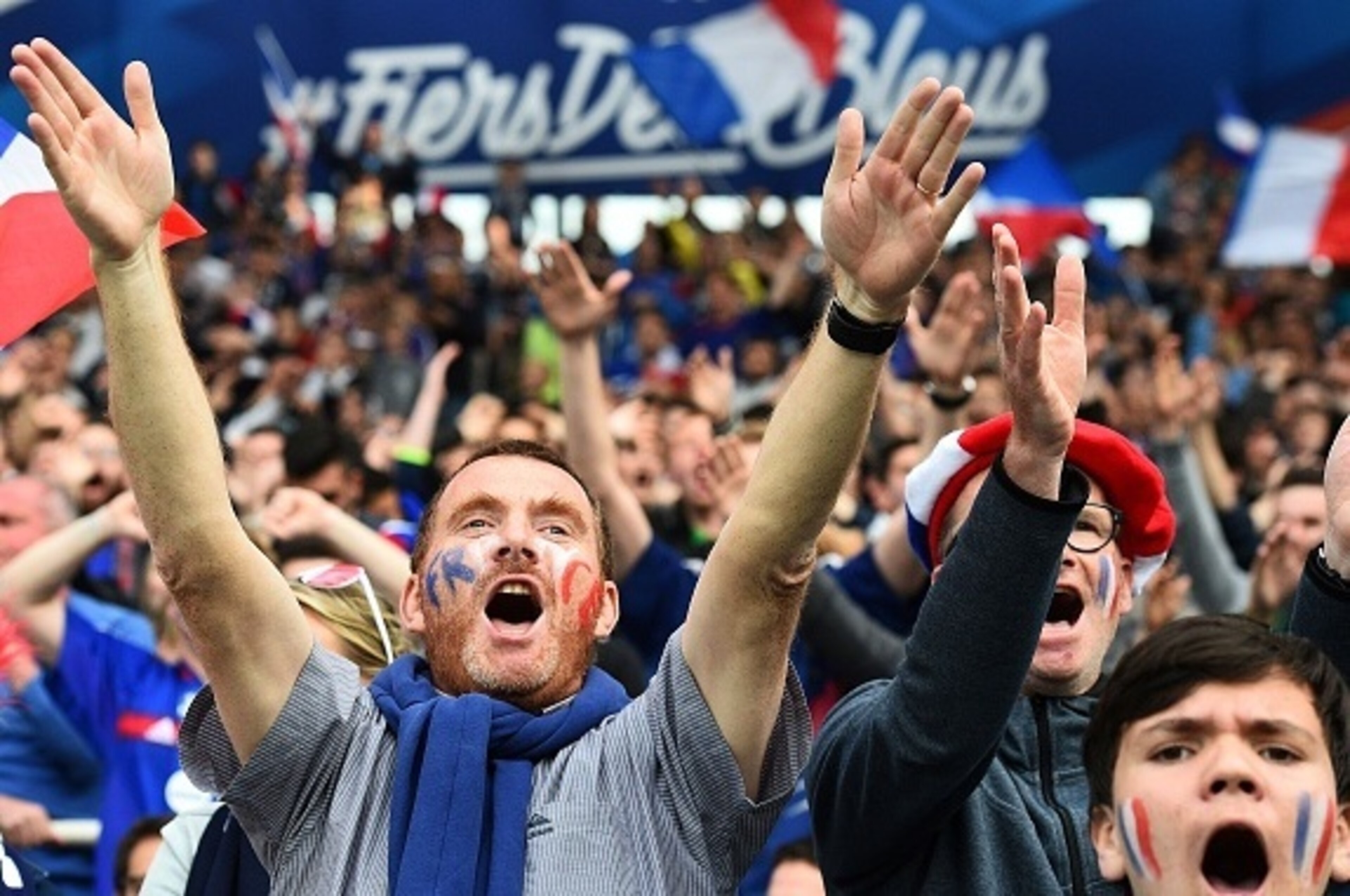 France's supporters cheer during the friendly football match between France and Cameroon, at the Beaujoire Stadium in Nantes, western France, on May 30, 2016. 
France won 3-2.   / AFP / FRANCK FIFE        (Photo credit should read FRANCK FIFE/AFP/Getty Im