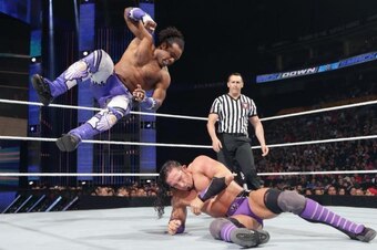 Xavier Woods dives at Neville on SmackDown.