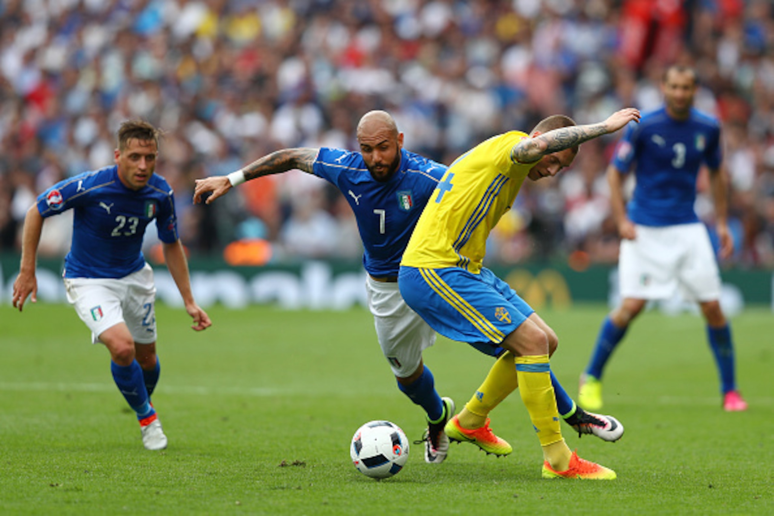 TOULOUSE, FRANCE - JUNE 17:  Simone Zaza of Italy tackles Victor Lindelof of Sweden during the UEFA EURO 2016 Group E match between Italy and Sweden at Stadium Municipal on June 17, 2016 in Toulouse, France.  (Photo by Dean Mouhtaropoulos/Getty Images)