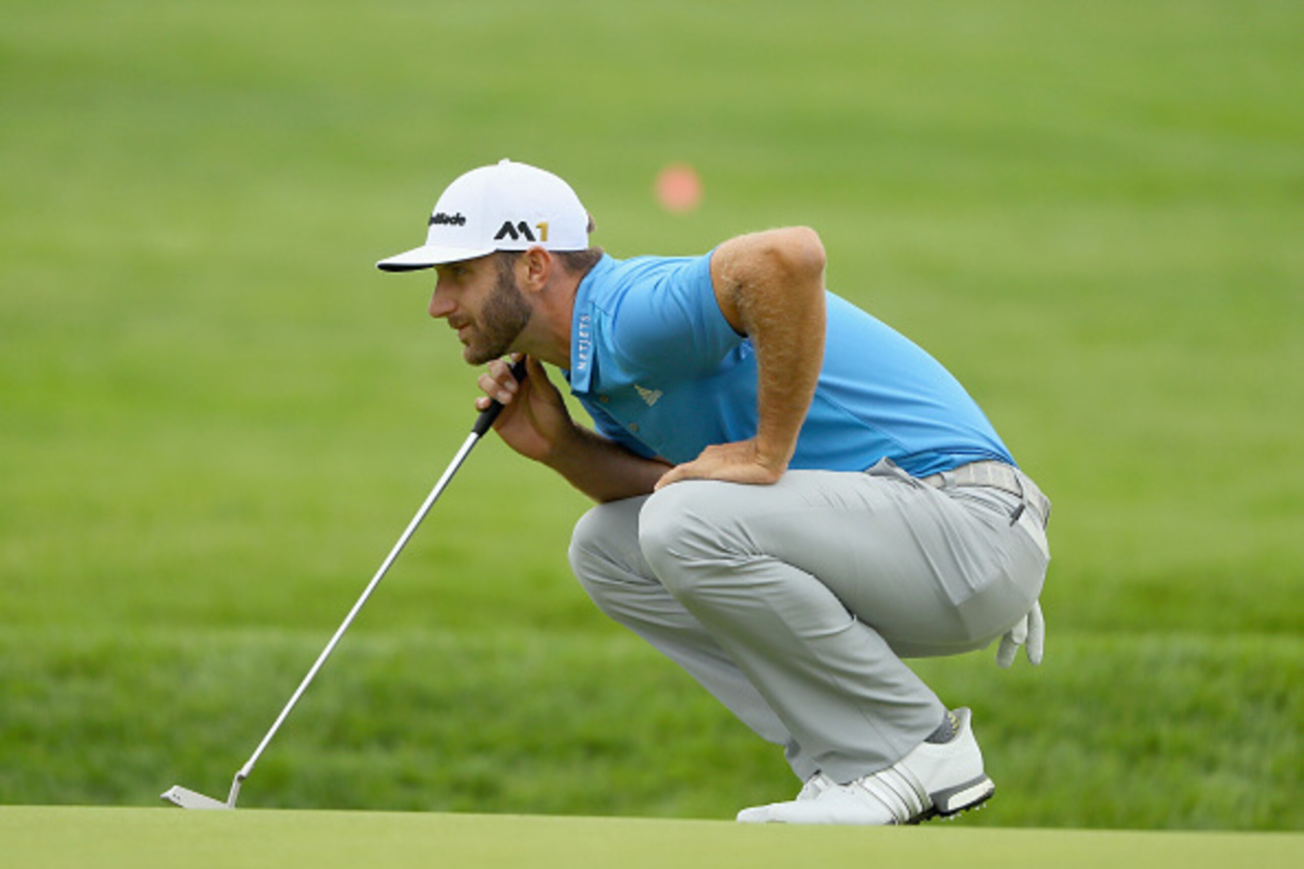 OAKMONT, PA - JUNE 17:  Dustin Johnson of the United States looks over a putt on the first green during the continuation of the weather delayed first round of the U.S. Open at Oakmont Country Club on June 17, 2016 in Oakmont, Pennsylvania.  (Photo by Andr