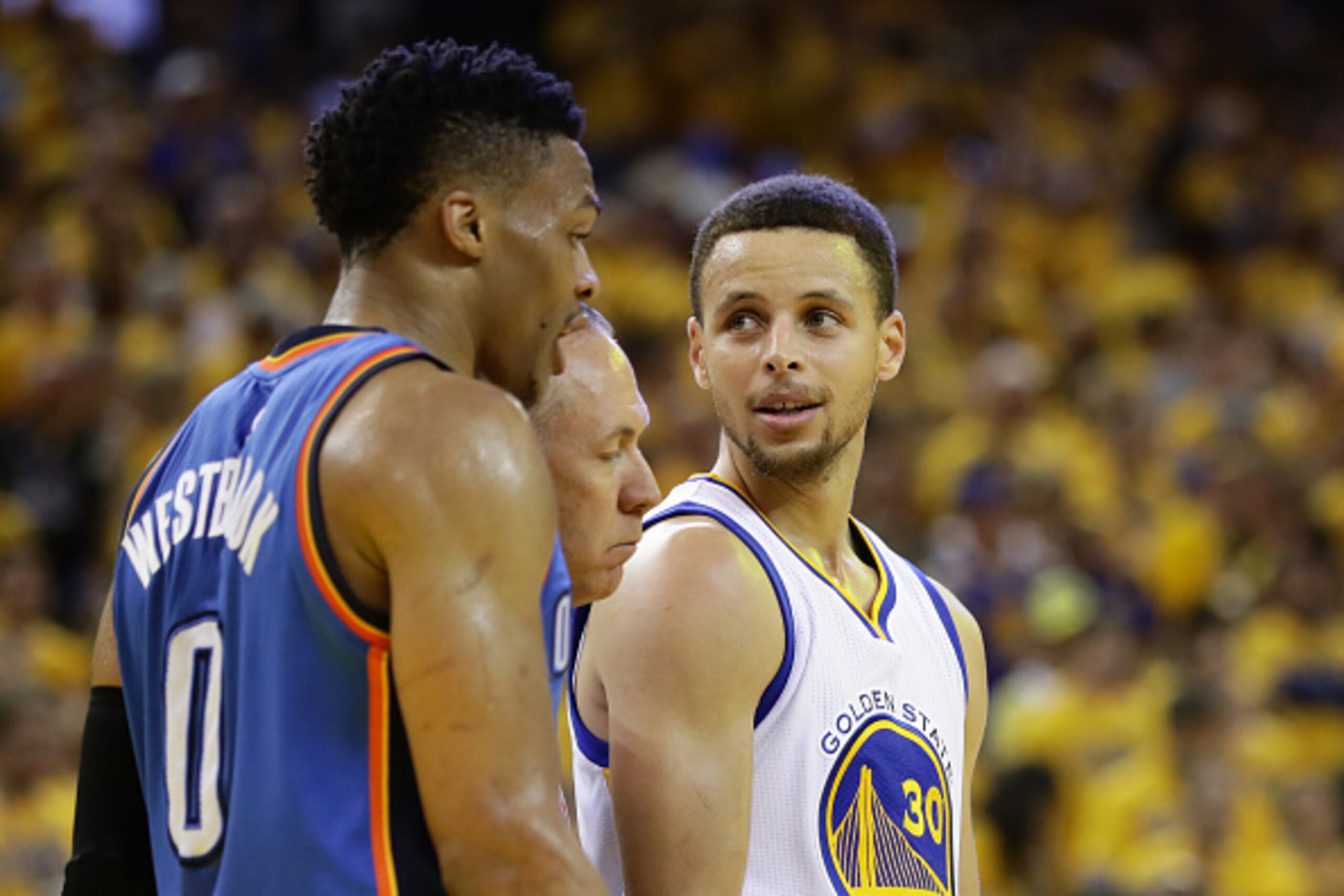 OAKLAND, CA - MAY 30:  Stephen Curry #30 of the Golden State Warriors and Russell Westbrook #0 of the Oklahoma City Thunder stand on the court in Game Seven of the Western Conference Finals during the 2016 NBA Playoffs at ORACLE Arena on May 30, 2016 in O