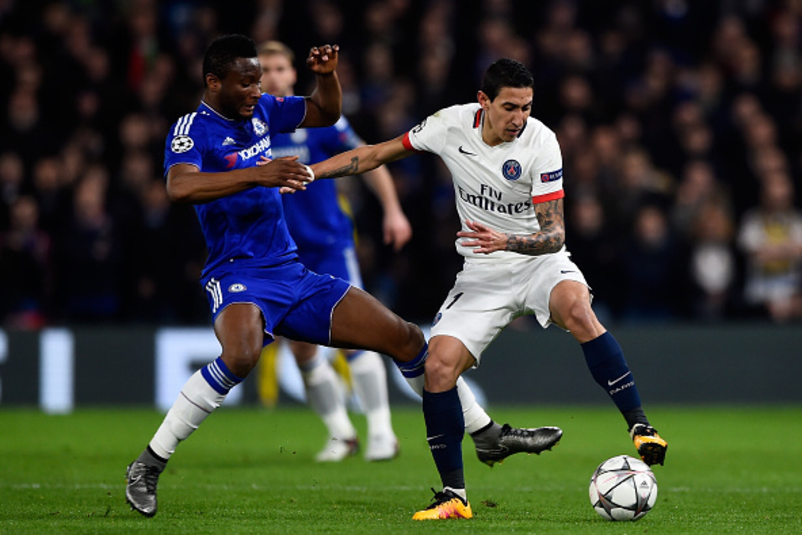 LONDON, ENGLAND - MARCH 09:  Angel Di Maria of PSG is challenged by John Mikel Obi of Chelsea during the UEFA Champions League round of 16, second leg match between Chelsea and Paris Saint Germain at Stamford Bridge on March 9, 2016 in London, United King