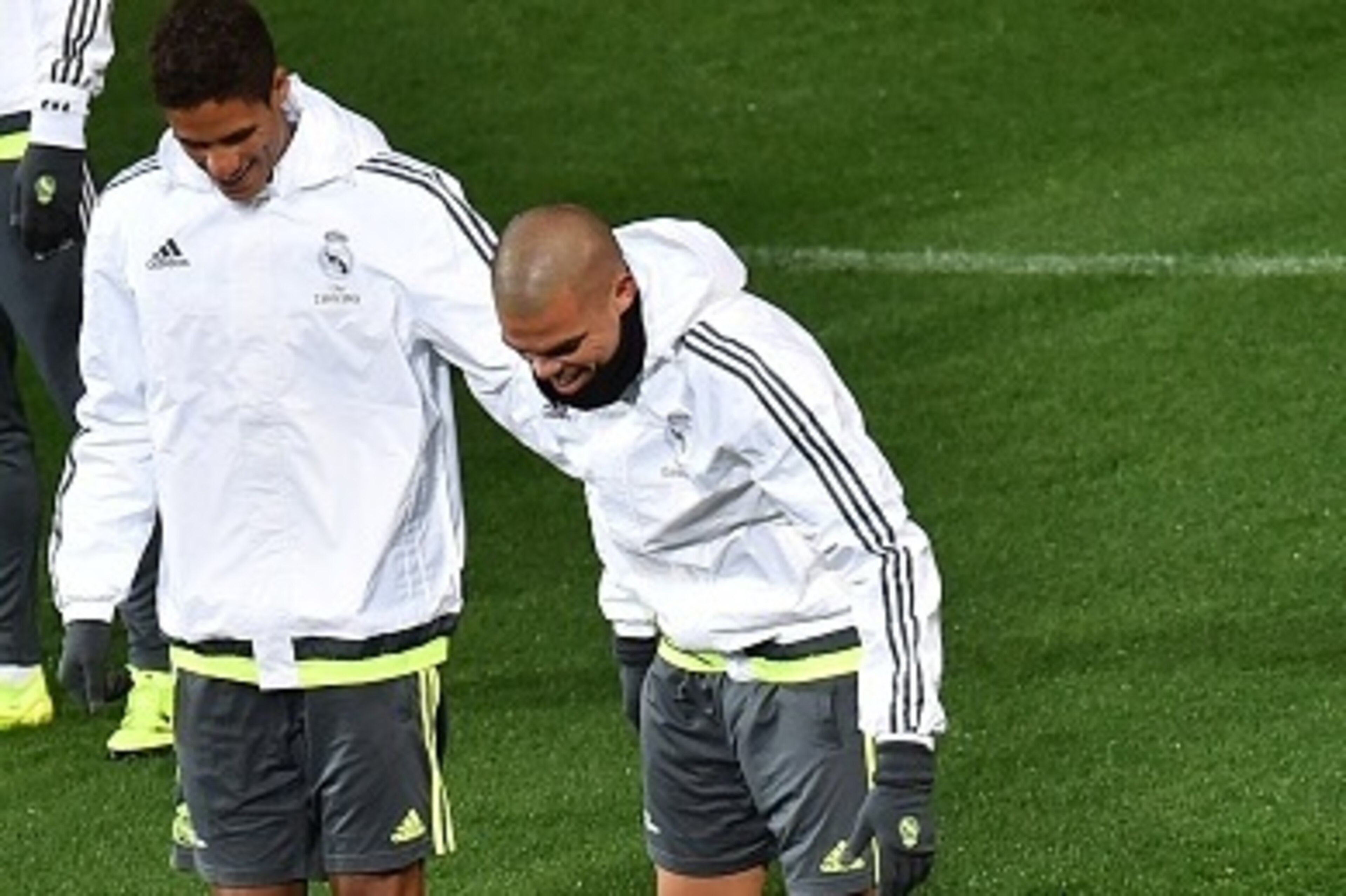 Real Madrid defenders Raphael Varane (L) and Pepe (R) share a smile as Cristiano Ronaldo (C) gestures on the ground after falling during a training session ahead of the International Champions Cup football tournament in Melbourne on July 14, 2015. AFP P Real Madrid defenders Raphael Varane (L) and Pepe (R) share a smile as Cristiano Ronaldo (C) gestures on the ground after falling during a training session ahead of the International Champions Cup football tournament in Melbourne on July 14, 2015. AFP P