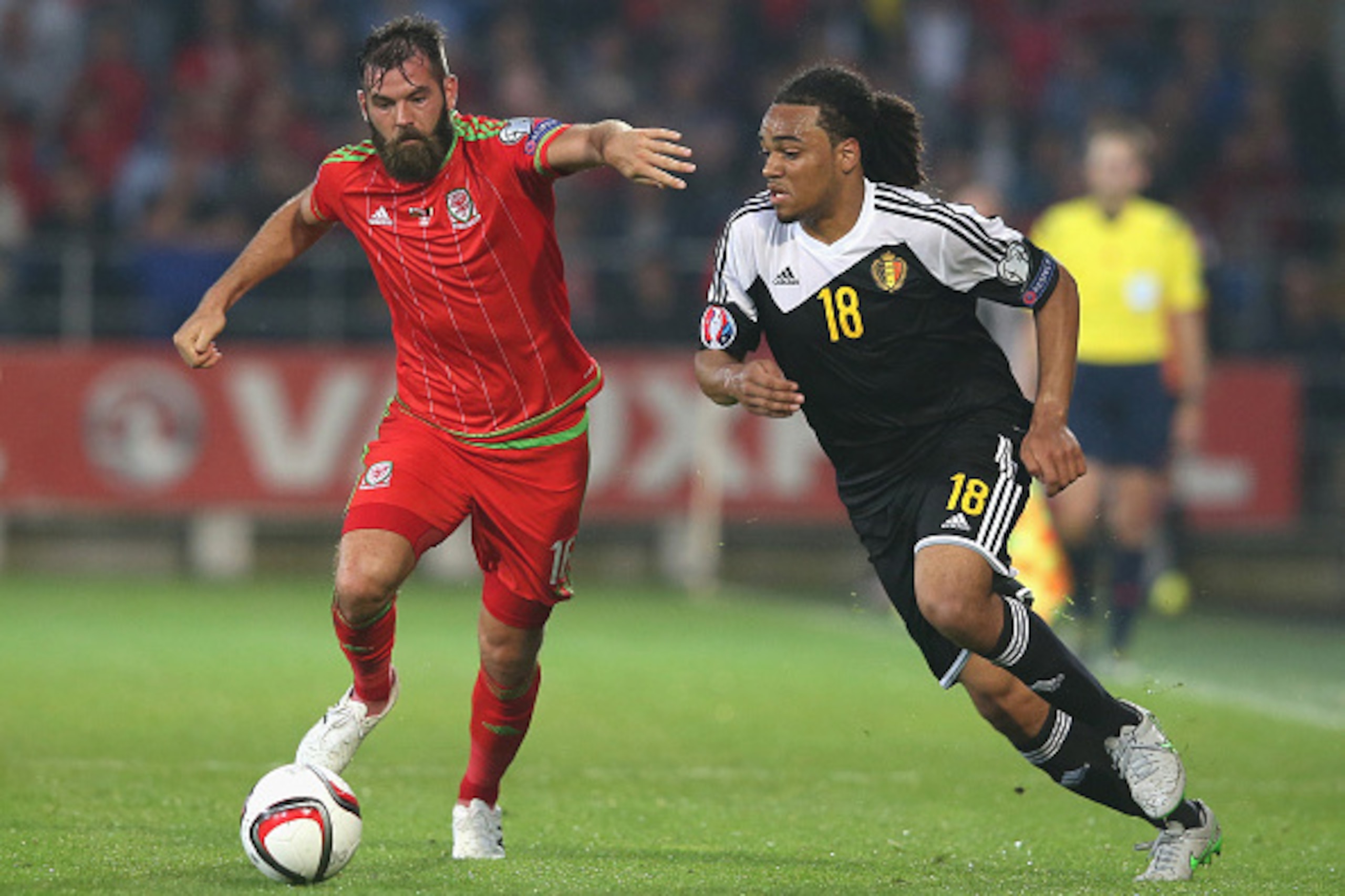 CARDIFF, WALES - JUNE 12:  Joe Ledley (L) of Wales moves away from Jason Denayer during the UEFA EURO 2016 qualifying match between Wales and Belgium at the Cardiff City Stadium on June 12, 2015 in Cardiff, United Kingdom.  (Photo by David Rogers/Getty Im