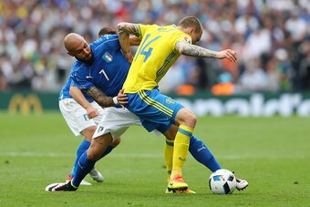 TOULOUSE, FRANCE - JUNE 17: Simone Zaza of Italy tackles Victor Lindelof of Sweden during the UEFA EURO 2016 Group E match between Italy and Sweden at Stadium Municipal on June 17, 2016 in Toulouse, France.  (Photo by Dean Mouhtaropoulos/Getty Images)
