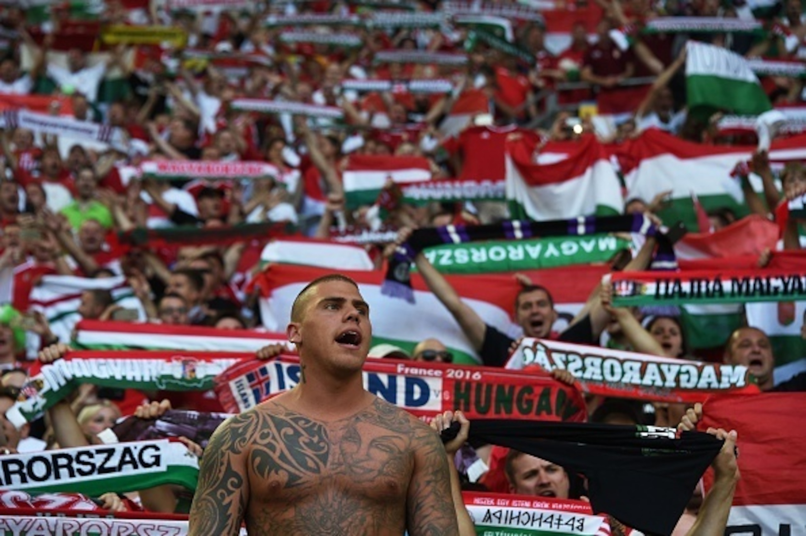 Hungary supporters chant at the end of the Euro 2016 group F football match between Iceland and Hungary at the Stade Velodrome in Marseille on June 18, 2016. / AFP / ANNE-CHRISTINE POUJOULAT (Photo credit should read ANNE-CHRISTINE POUJOULAT/AFP/G Hungary supporters chant at the end of the Euro 2016 group F football match between Iceland and Hungary at the Stade Velodrome in Marseille on June 18, 2016. / AFP / ANNE-CHRISTINE POUJOULAT (Photo credit should read ANNE-CHRISTINE POUJOULAT/AFP/G